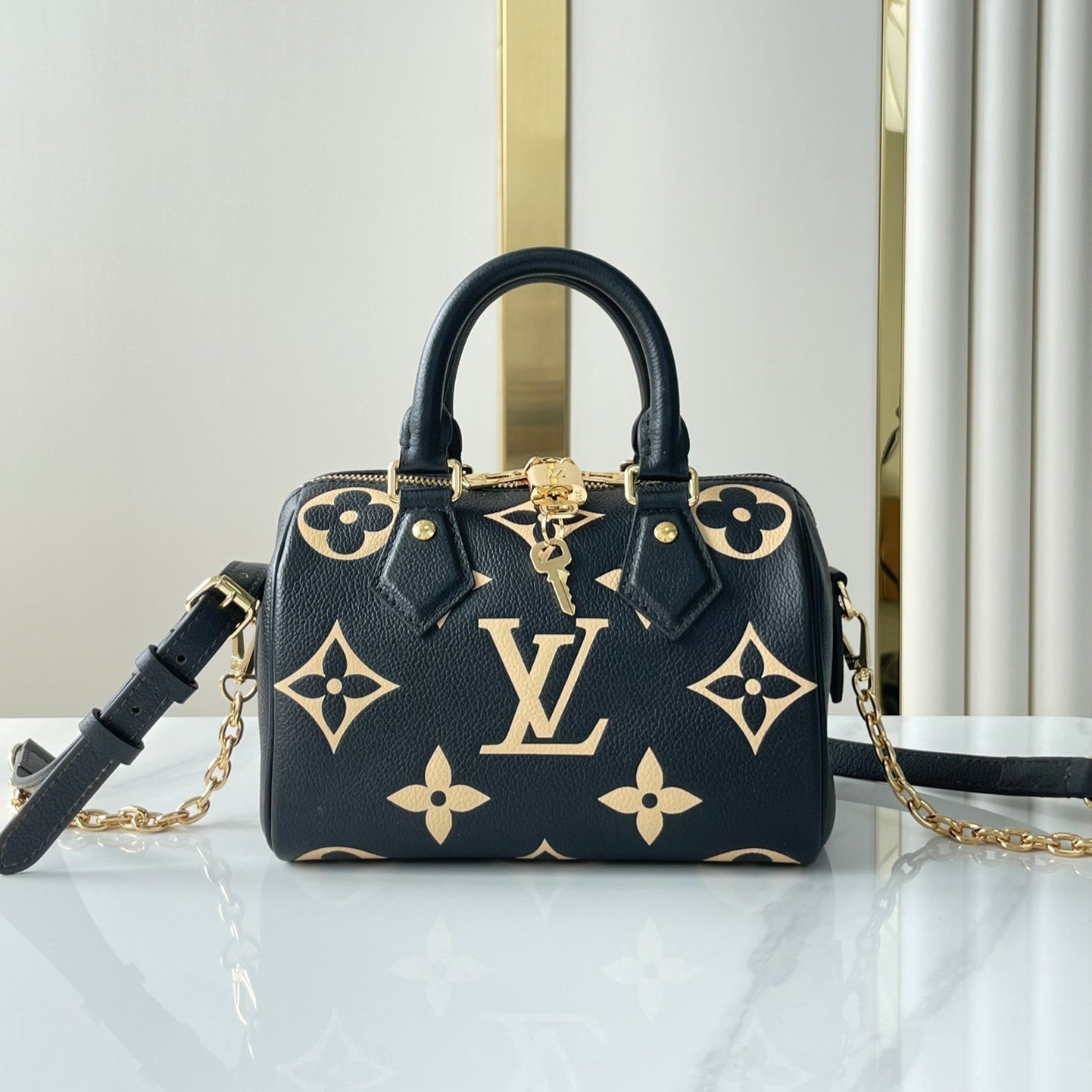 LOUIS VUITTON SPEEDY BANDOULIÈRE 20 IN BLACK CREAM MONOGRAM EMPREINTE LEATHER GOLD HARDWARE