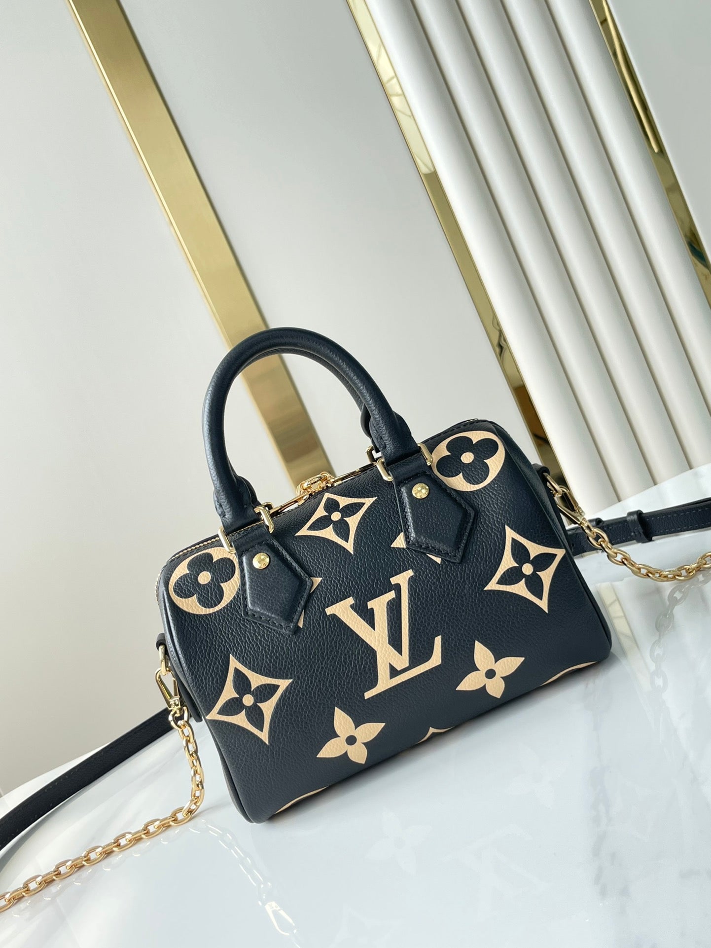 LOUIS VUITTON SPEEDY BANDOULIÈRE 20 IN BLACK CREAM MONOGRAM EMPREINTE LEATHER GOLD HARDWARE