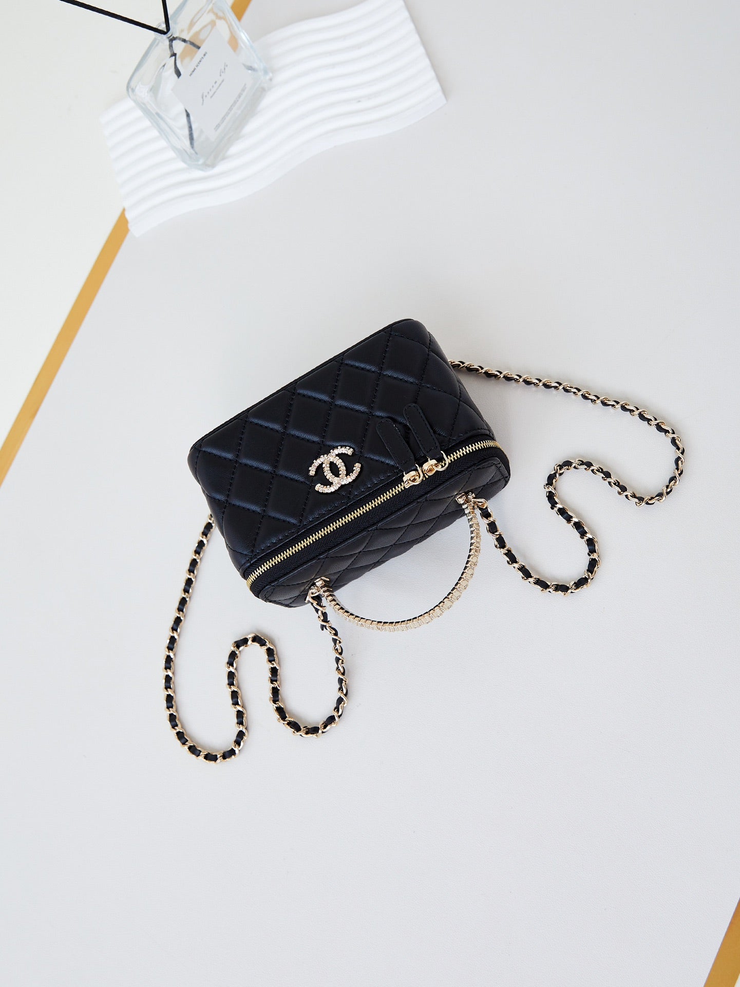 CHANEL 25S MINI VANITY BAG 16 CM IN BLACK LAMBSKIN WITH CRYSTAL-EMBELLISHED  LOGO