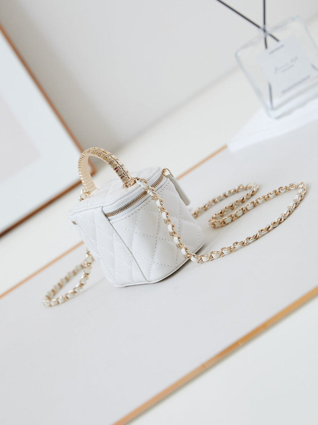CHANEL 25S MINI VANITY BAG 11 CM IN WHITE LAMBSKIN WITH CRYSTAL-EMBELLISHED  LOGO