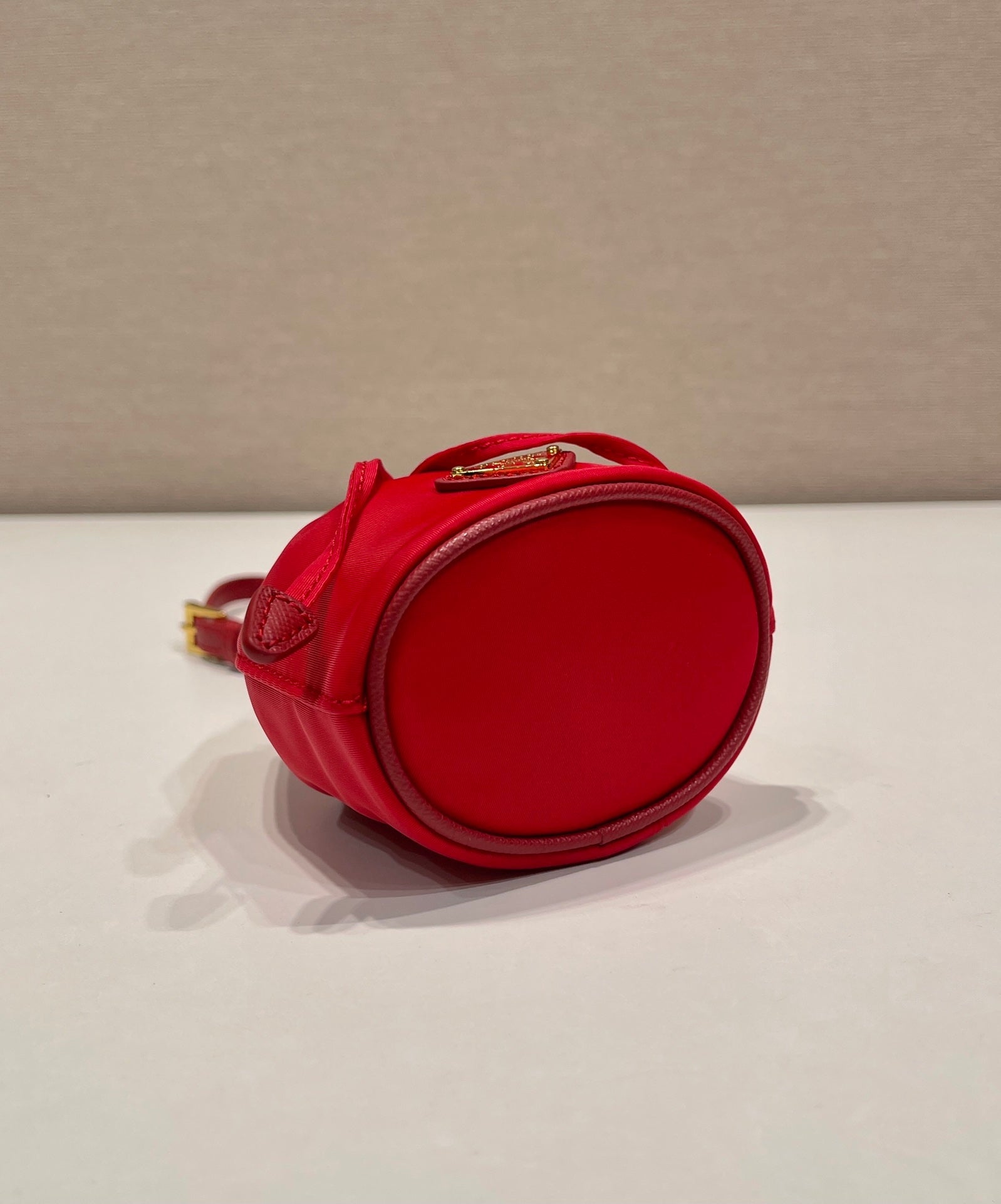PRADA MINI BUCKET BAG 10 IN RED RE-NYLON AND SAFFIANO LEATHER STRAP