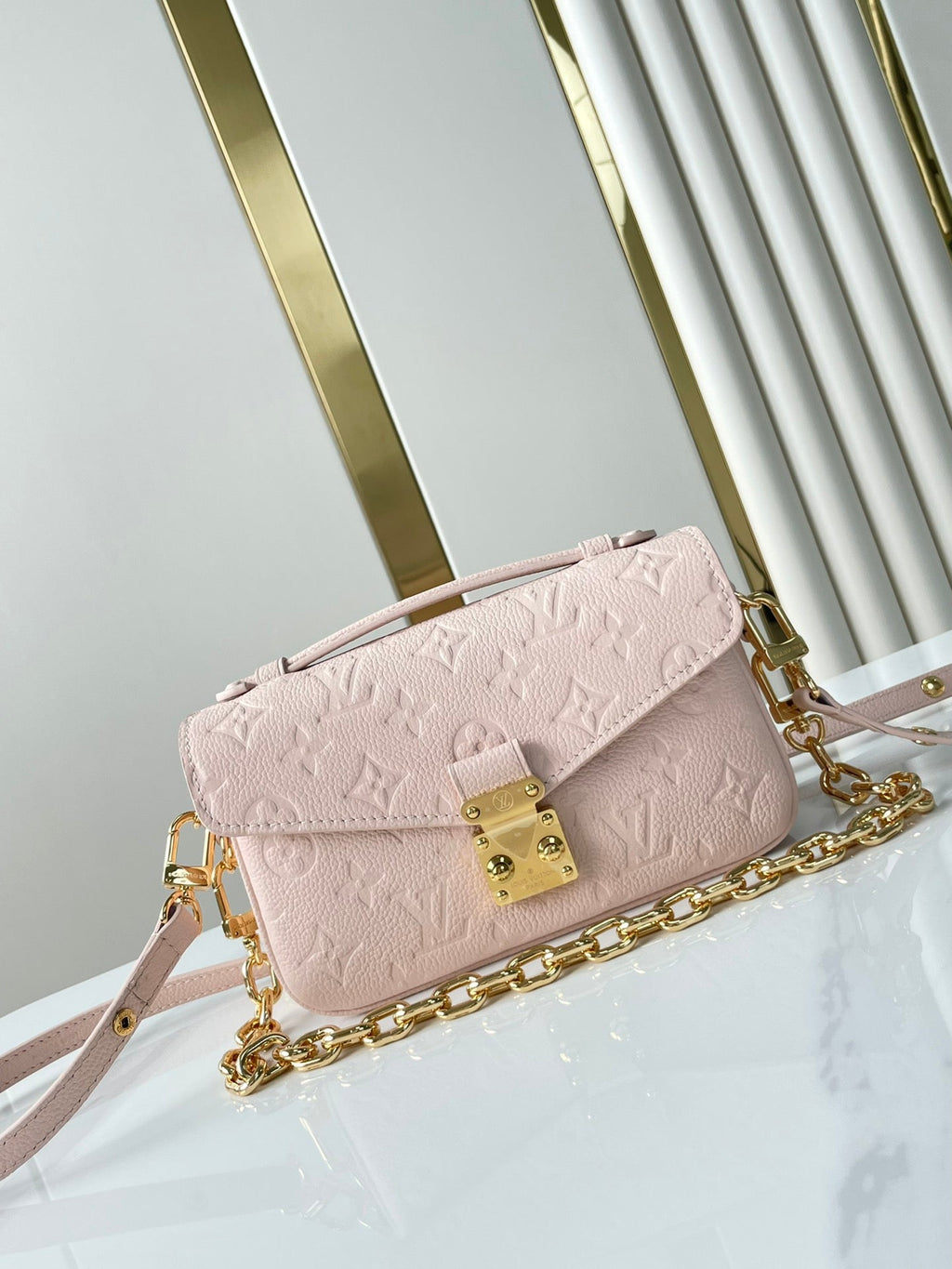 LOUIS VUITTON POCHETTE MÉTIS EAST WEST 21 IN PINK OPALE MONOGRAM ECLIPSE CANVAS GOLD BUCKLE