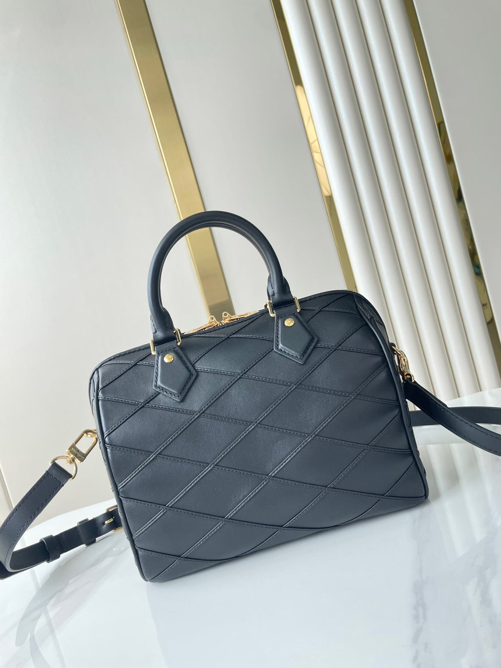 LOUIS VUITTON SPEEDY BANDOULIÈRE 25 WITH CRISS CROSS PATTERN IN BLACK LAMBSKIN