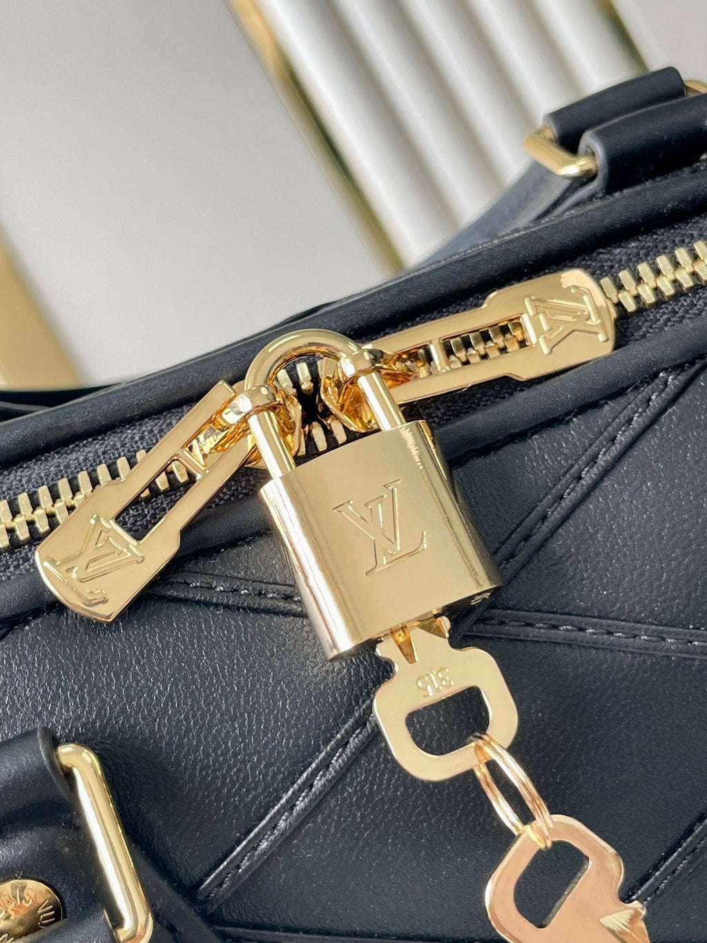 LOUIS VUITTON SPEEDY BANDOULIÈRE 25 WITH CRISS CROSS PATTERN IN BLACK LAMBSKIN