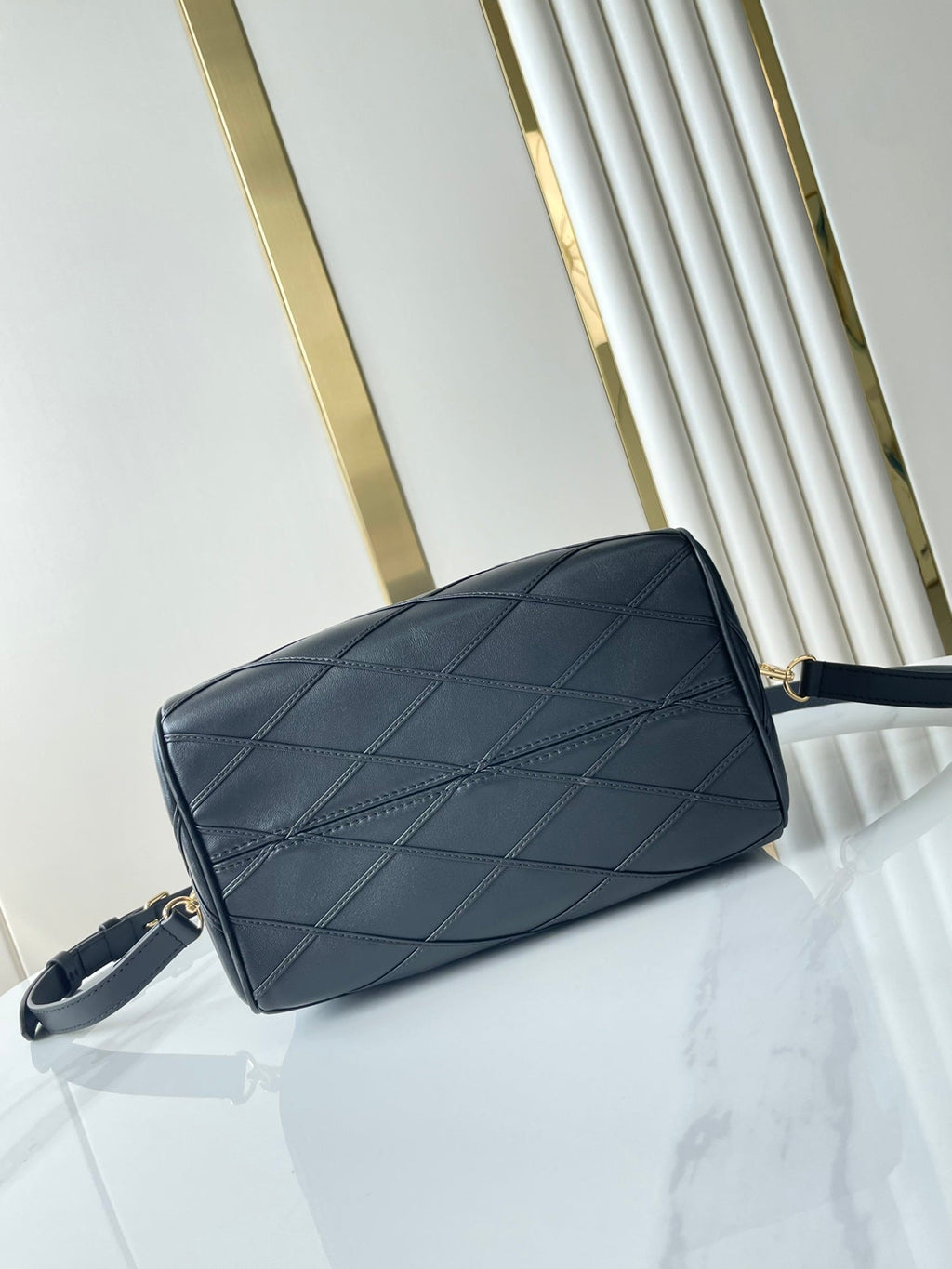 LOUIS VUITTON SPEEDY BANDOULIÈRE 25 WITH CRISS CROSS PATTERN IN BLACK LAMBSKIN