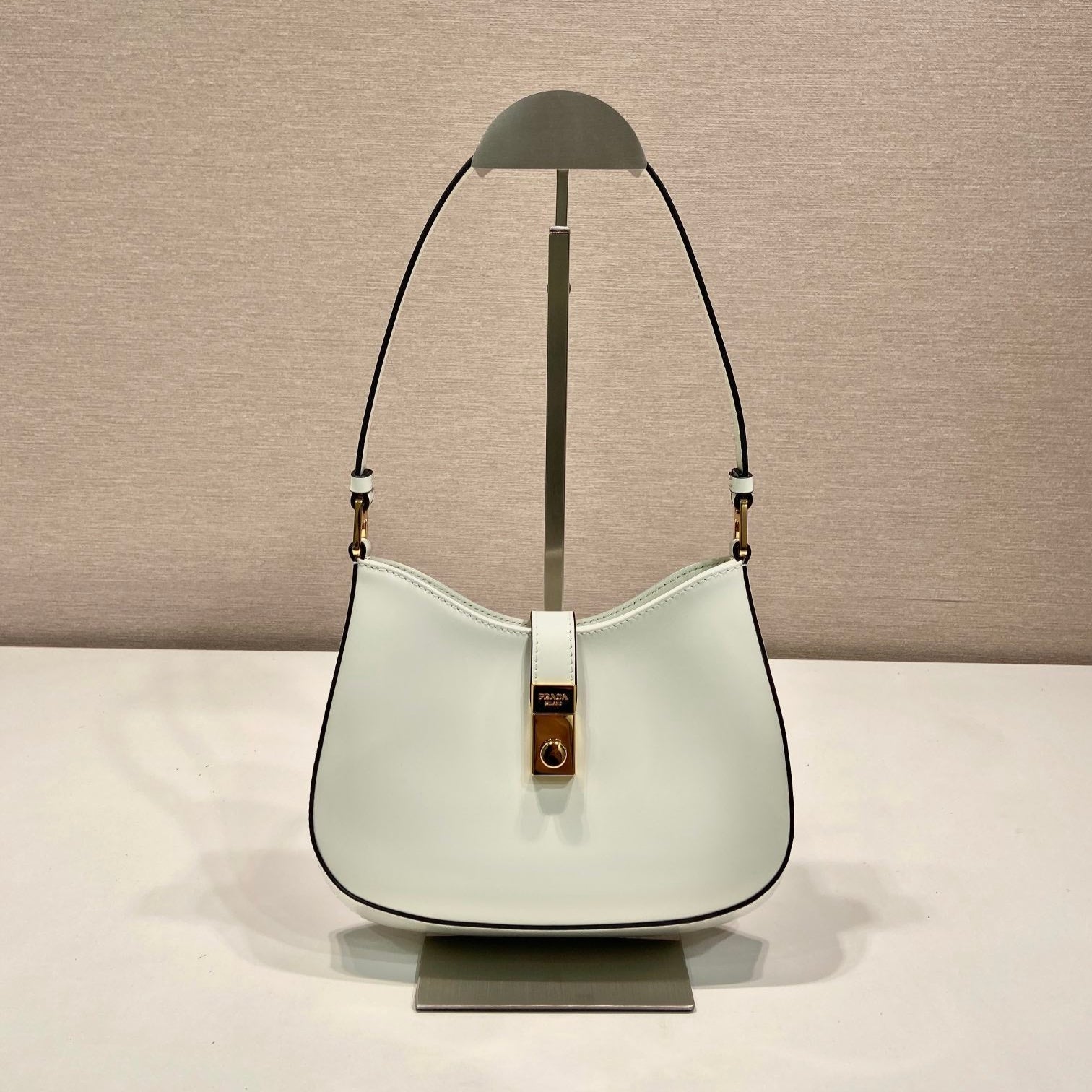 PRADA CLEO SHOULDER BAG 22 IN WHITE BRUSHED LAMBSKIN WITH CLASP CLOSURE