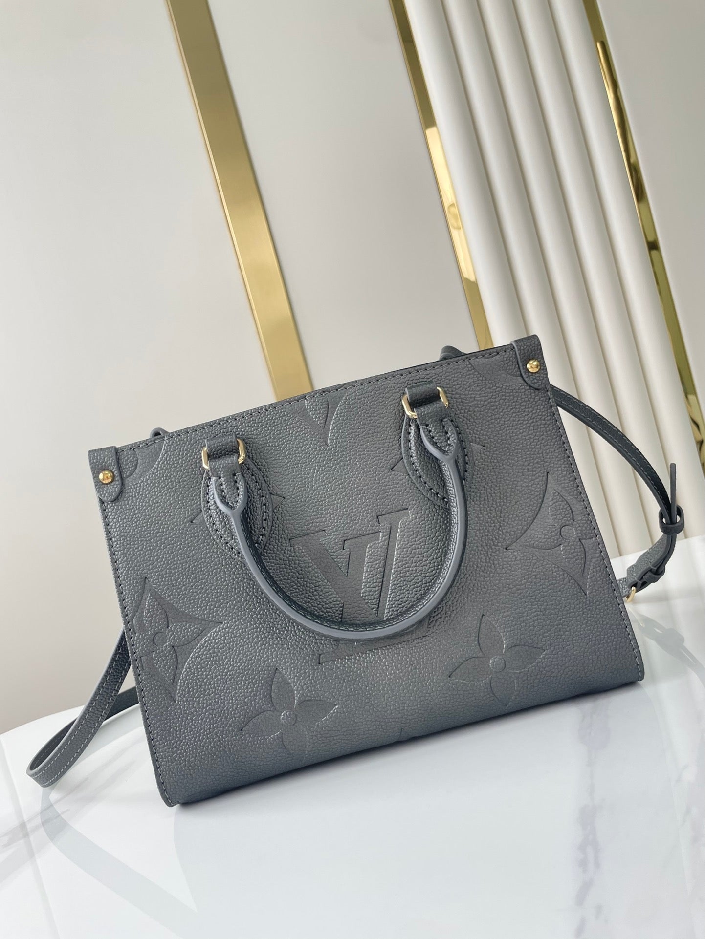 LOUIS VUITTON ONTHEGO PM 25 IN GUN METAL EMBOSSED CALFSKIN