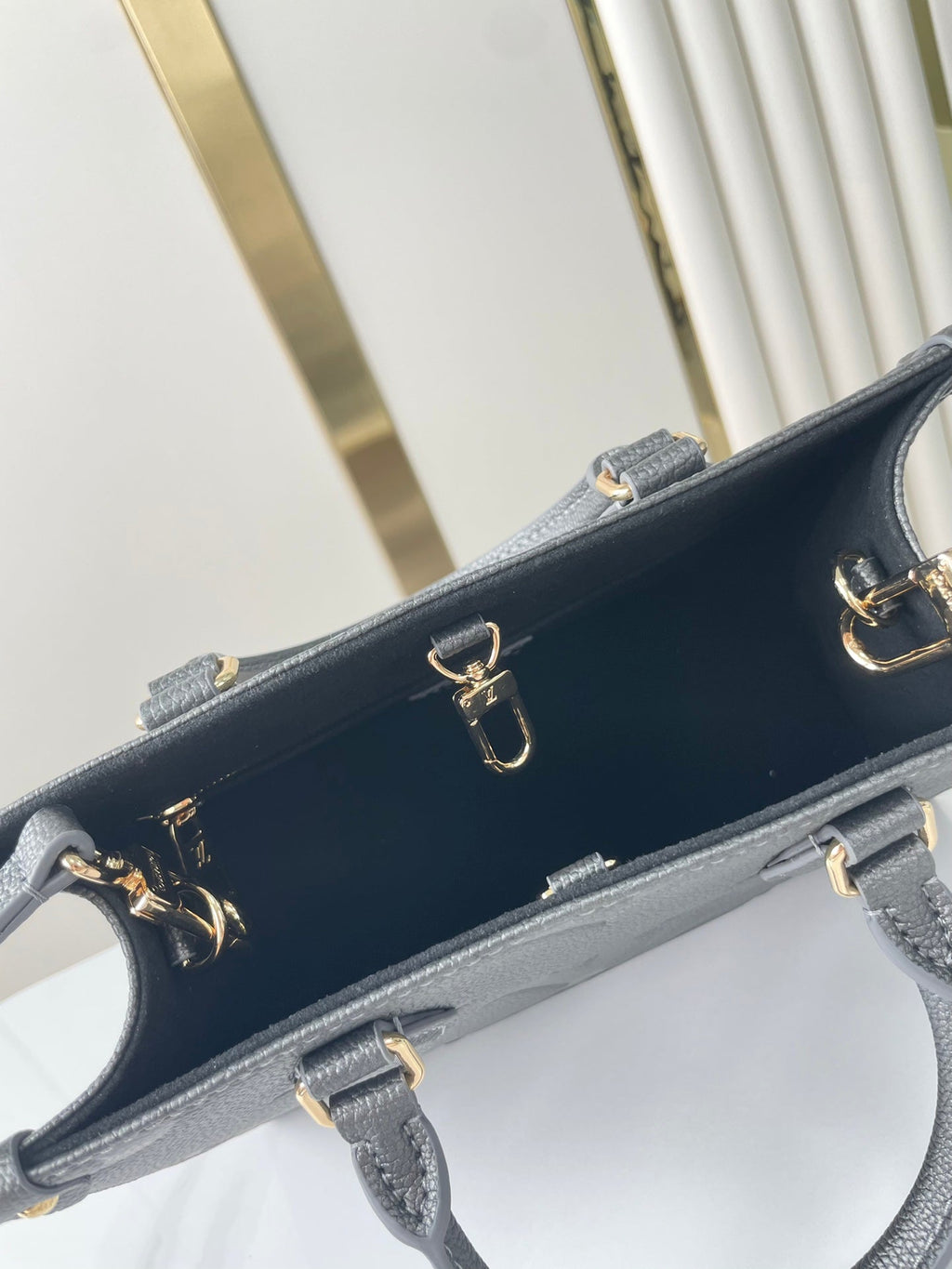 LOUIS VUITTON ONTHEGO PM 25 IN GUN METAL EMBOSSED CALFSKIN
