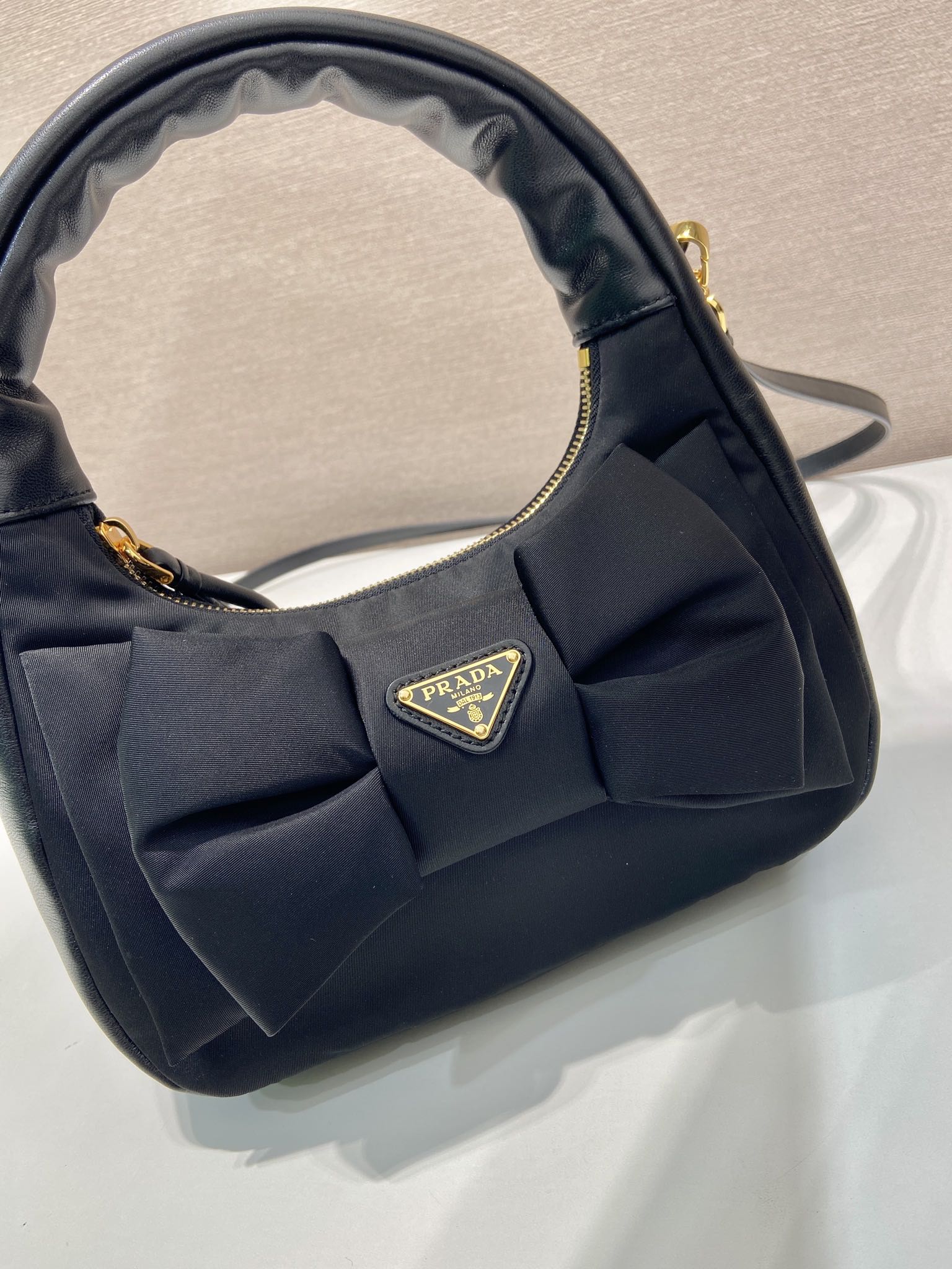 PRADA BOW HOBO BAG 22 IN BLACK RE-NYLON AND LAMBSKIN