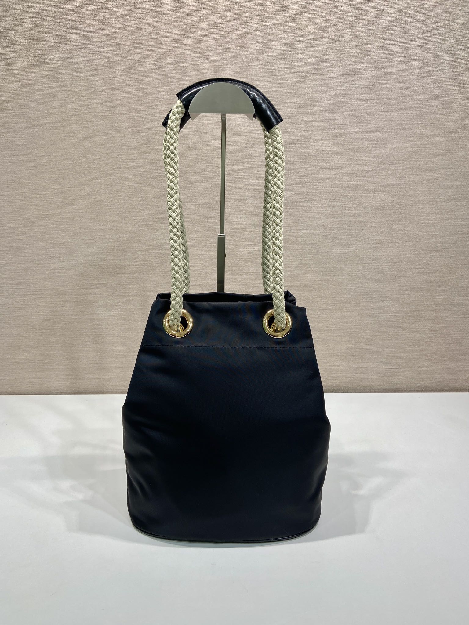 PRADA BUCKET BAG 28 IN BLACK RE-NYLON GOLD LOGO