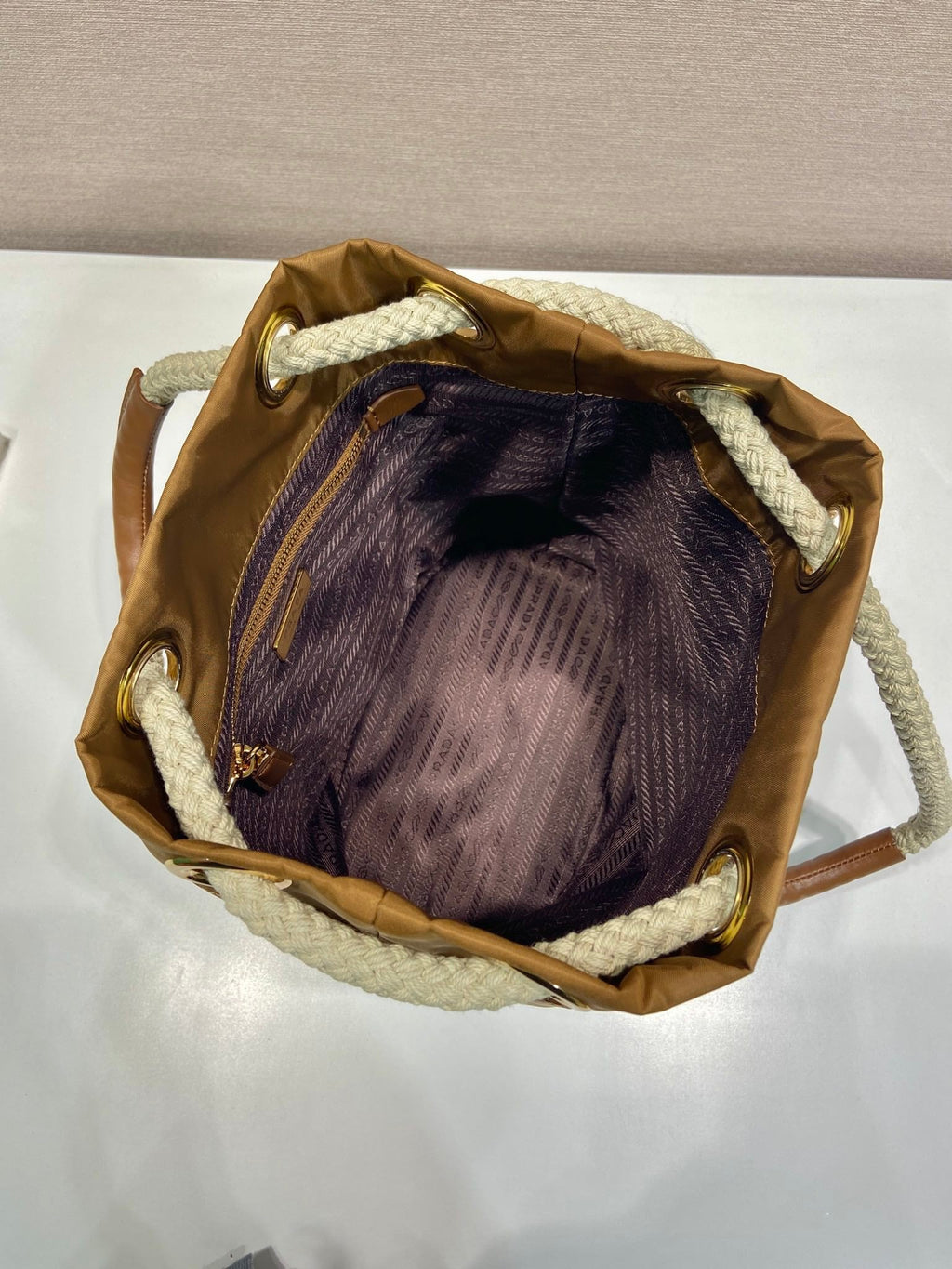 PRADA BUCKET BAG 28 IN SEPIA BROWN RE-NYLON GOLD LOGO