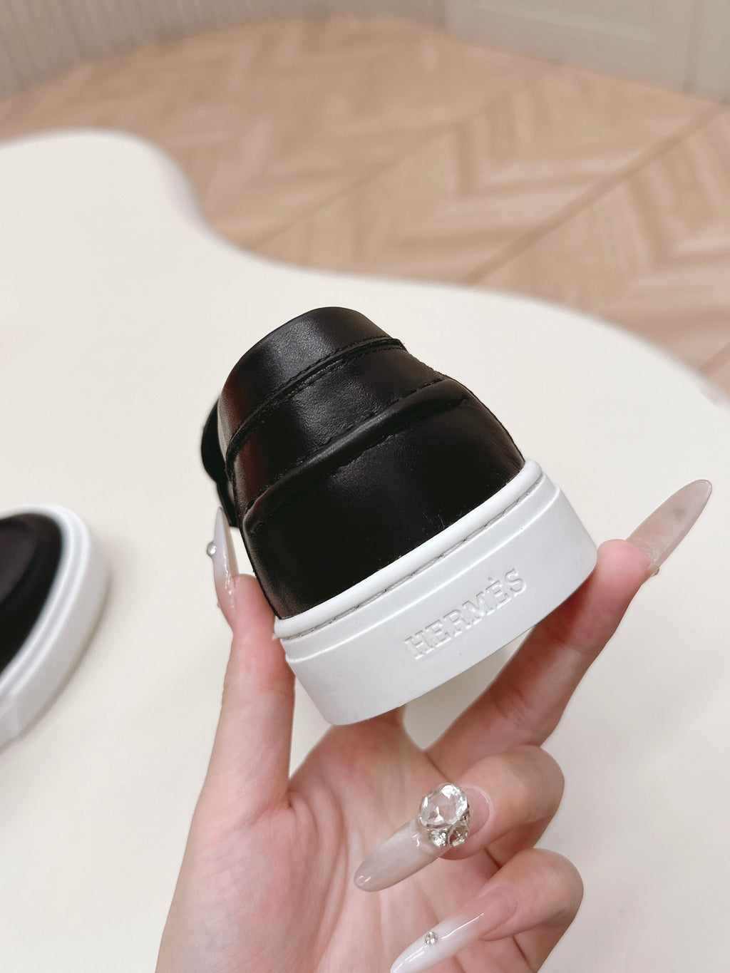 HERMES 25S SLIP-ON IN BLACK LAMBSKIN