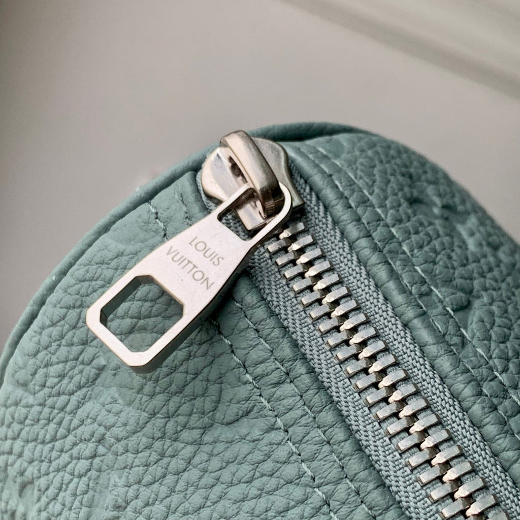 LOUIS VUITTON KEEPALL BANDOULIÈRE 25 BAG IN MISTY LAKE GREEN MONOGRAM TAURILLON CALFSKIN