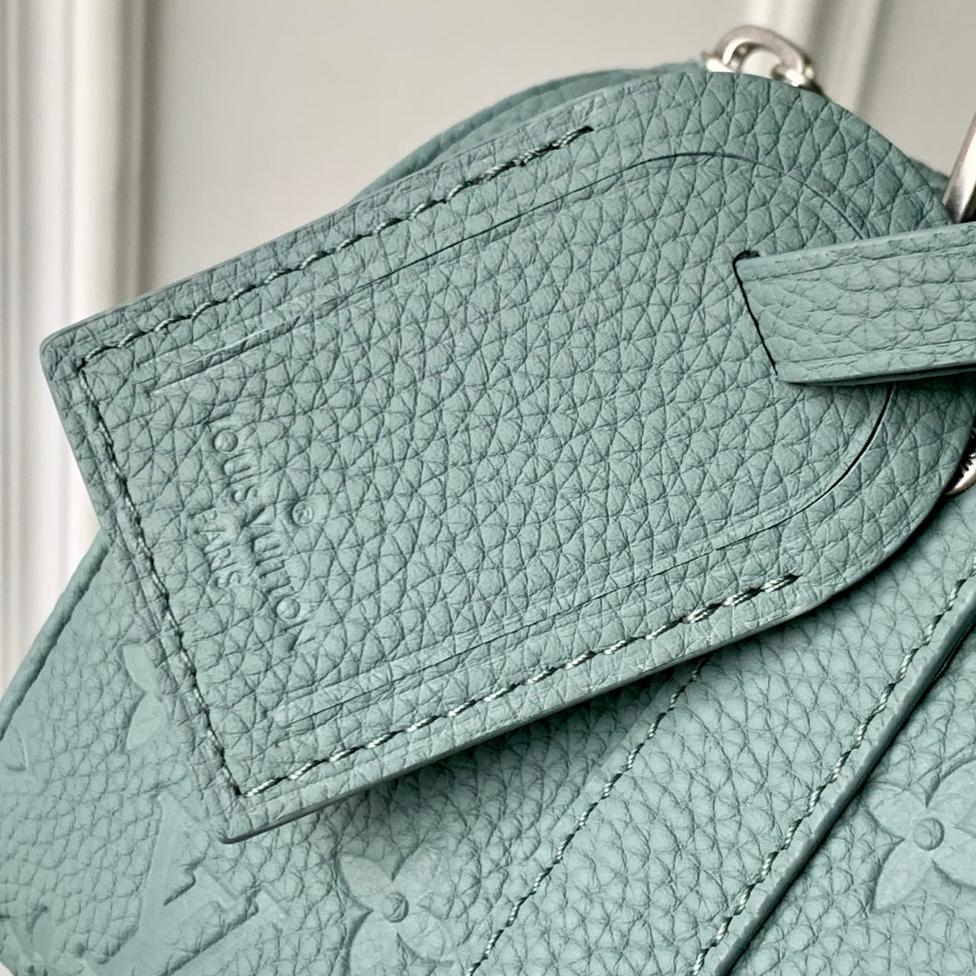 LOUIS VUITTON KEEPALL BANDOULIÈRE 25 BAG IN MISTY LAKE GREEN MONOGRAM TAURILLON CALFSKIN