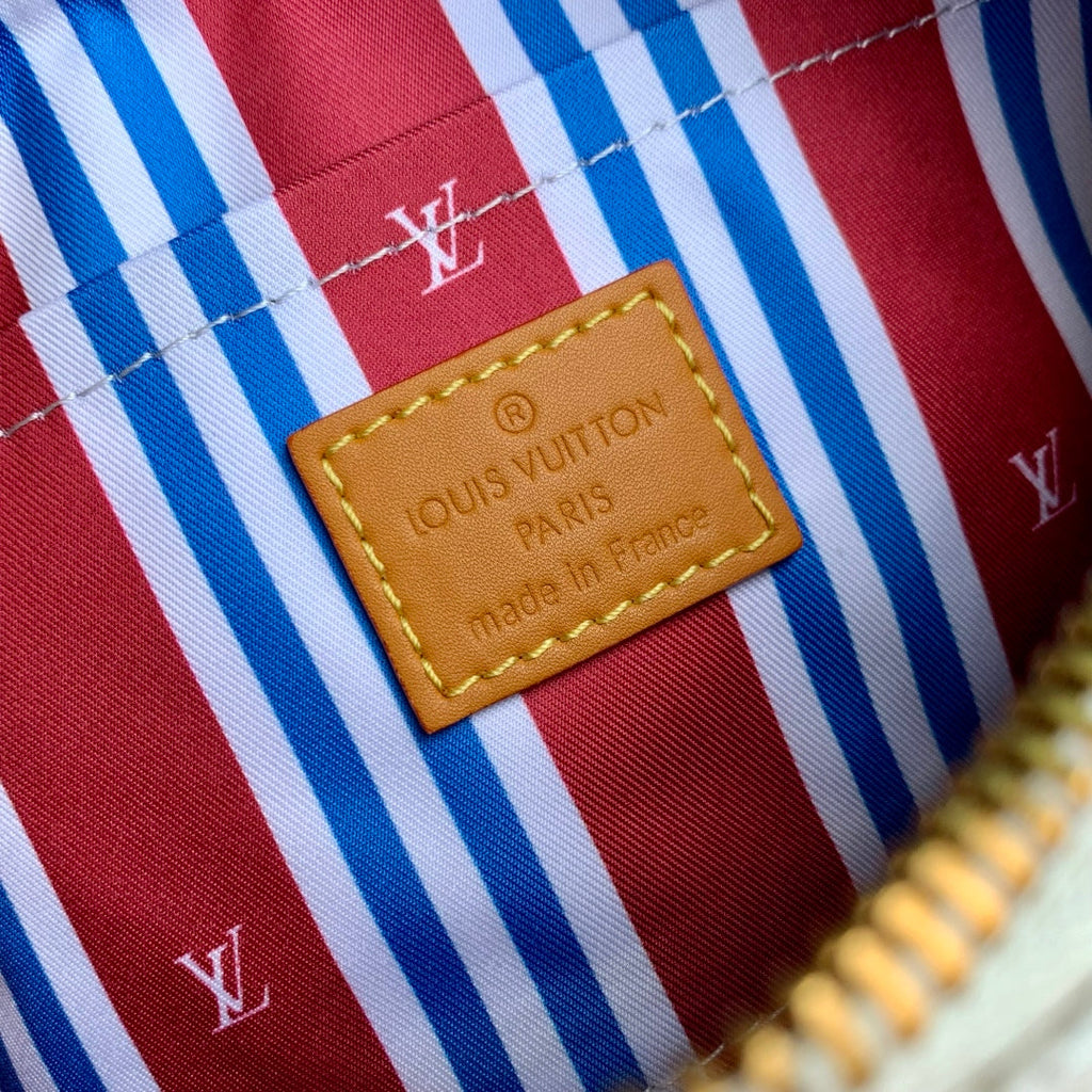 LOUIS VUITTON KEEPALL BANDOULIÈRE 25 IN WHITE MONOGRAM HERITAGE CANVAS BRWON CALFSKIN