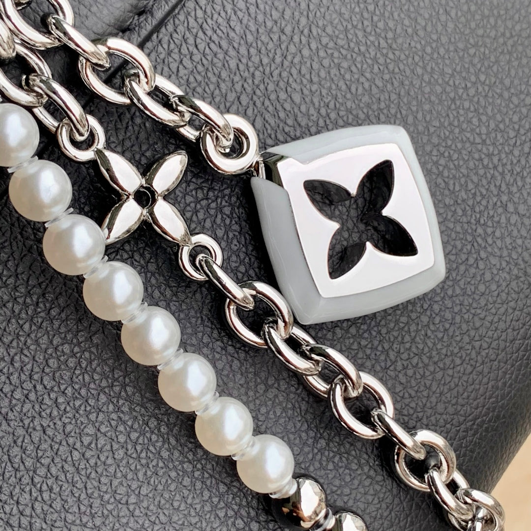 LOUIS VUITTON TWIST SLIM 19 IN BLACK TAURILLON CALFSKIN WITH PEARL CHAIN