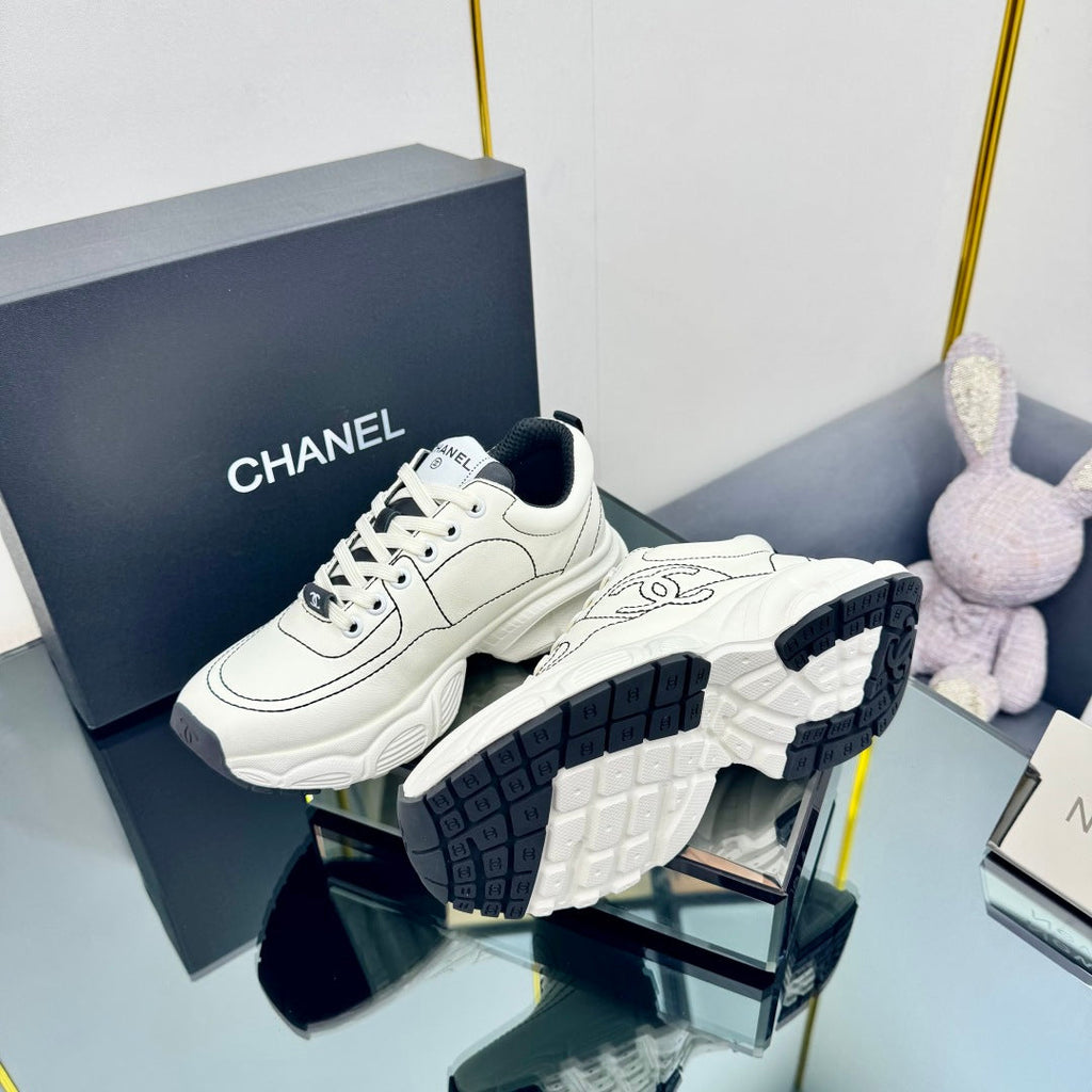 CHANEL TRAINERS SNEAKER IN WHITE CALFSKIN WITH BLACK EMBROIDERED