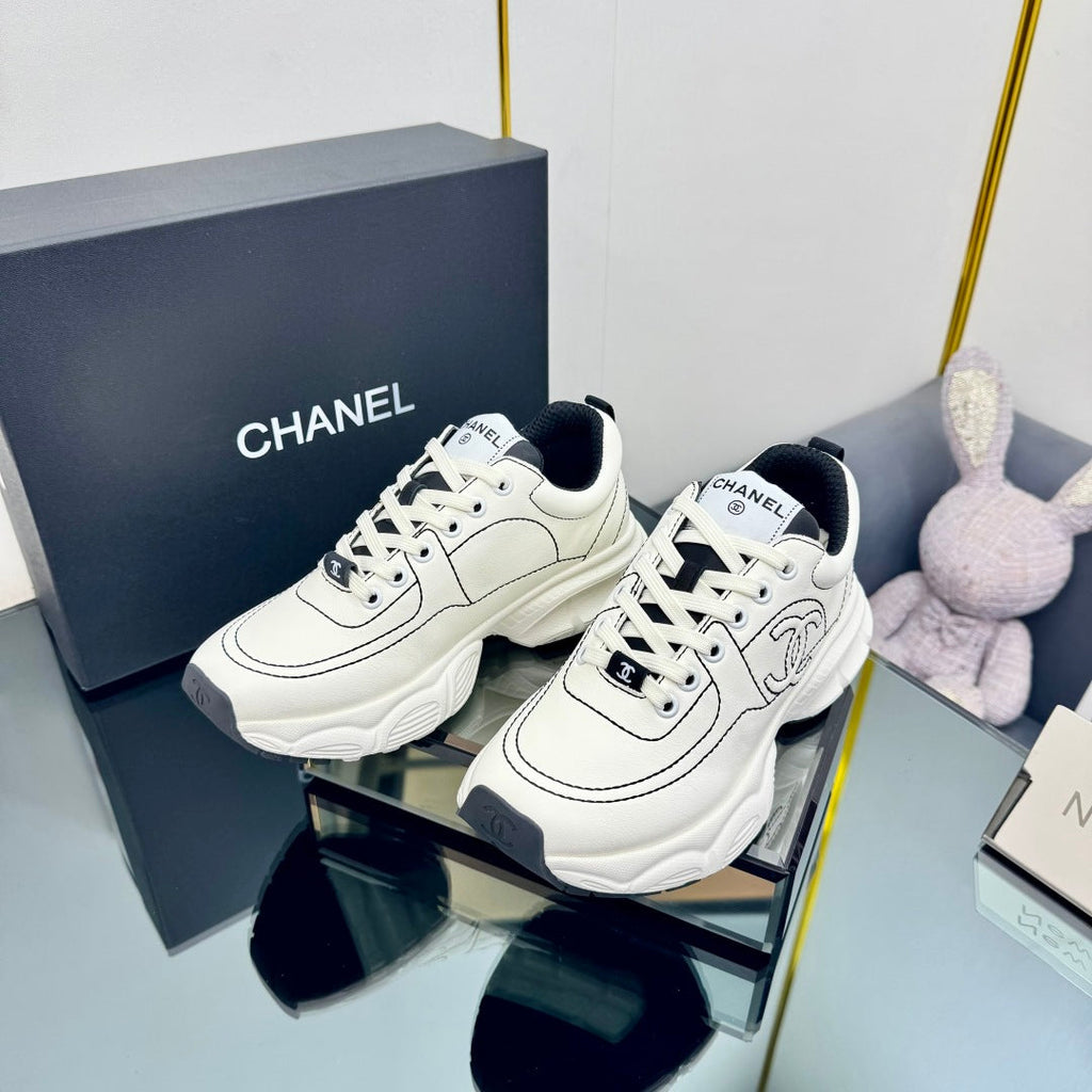 CHANEL TRAINERS SNEAKER IN WHITE CALFSKIN WITH BLACK EMBROIDERED