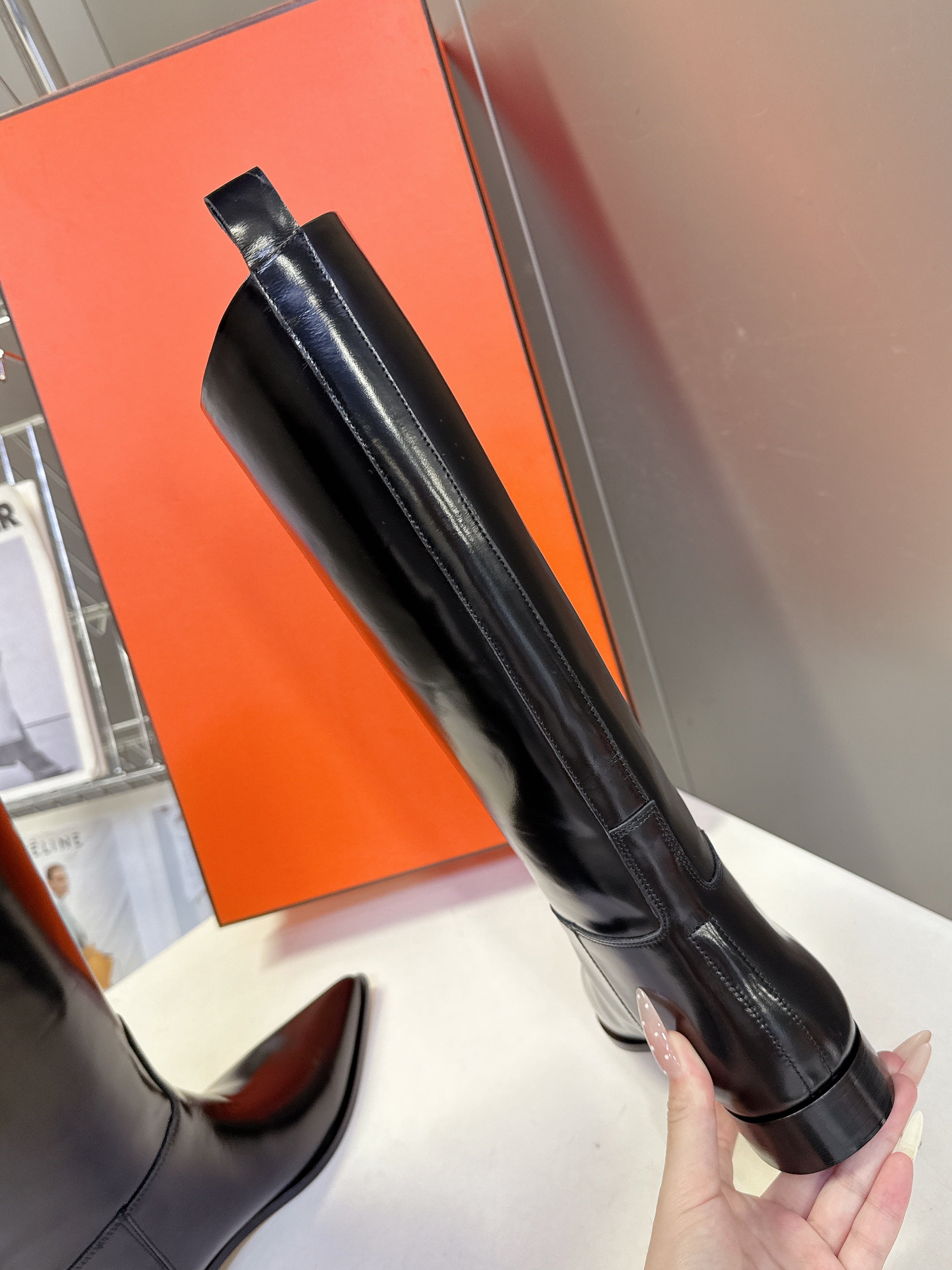 HERMES 25S POINTED-TOE KNEE-HIGH BOOTS IN BLACK GLOSSY LAMBSKIN