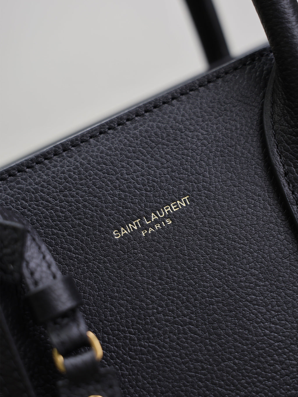 YSL 25S SAC DE JOUR GM 32 IN BLACK SUPPLE GRAINED CALFSKIN GOLD HARDWARE