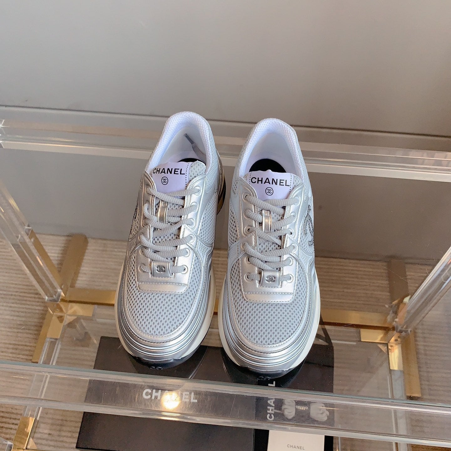 CHANEL SNEAKERS IN GLOSSY SILVER CALFSKIN AND MESH