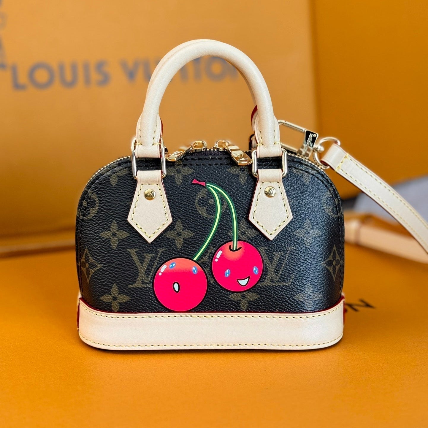 LOUIS VUITTON LV 25S NANO ALMA 18 IN DARK BROWN CANVAS MONOGRAM CHERRY PRINT GOLD HARDWARE
