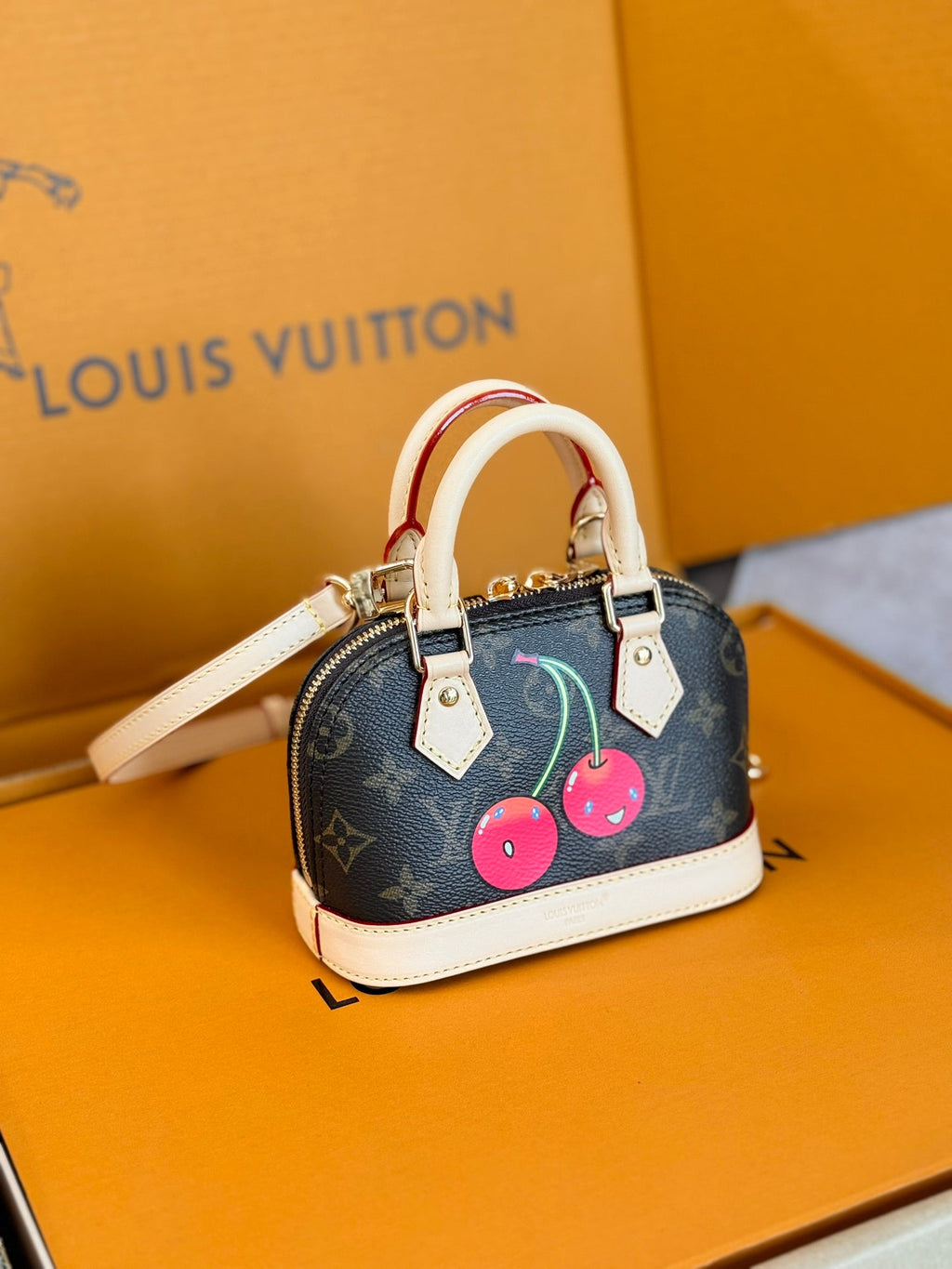 LOUIS VUITTON LV 25S NANO ALMA 18 IN DARK BROWN CANVAS MONOGRAM CHERRY PRINT GOLD HARDWARE