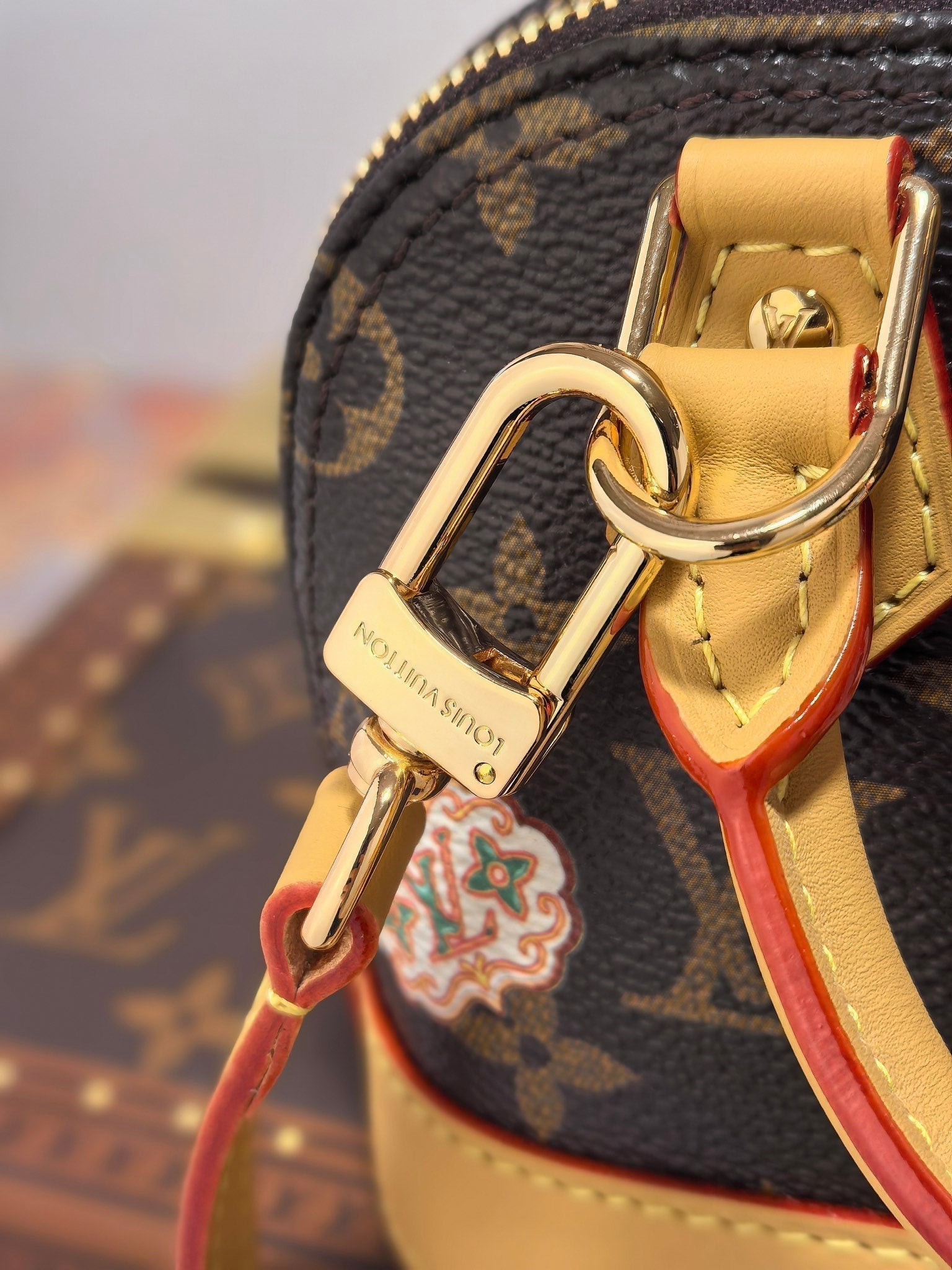 LOUIS VUITTON LV 25S NANO ALMA 18 IN BROWN MONOGRAM CANVAS PRINTED WITH THE VIVIENNE MASCOT