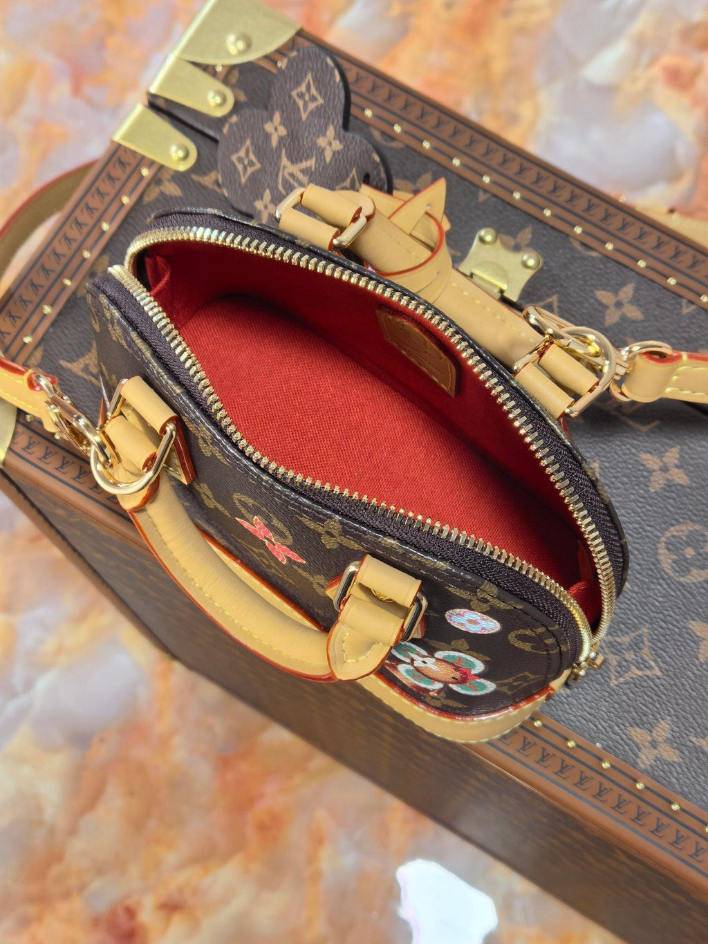 LOUIS VUITTON LV 25S NANO ALMA 18 IN BROWN MONOGRAM CANVAS PRINTED WITH THE VIVIENNE MASCOT