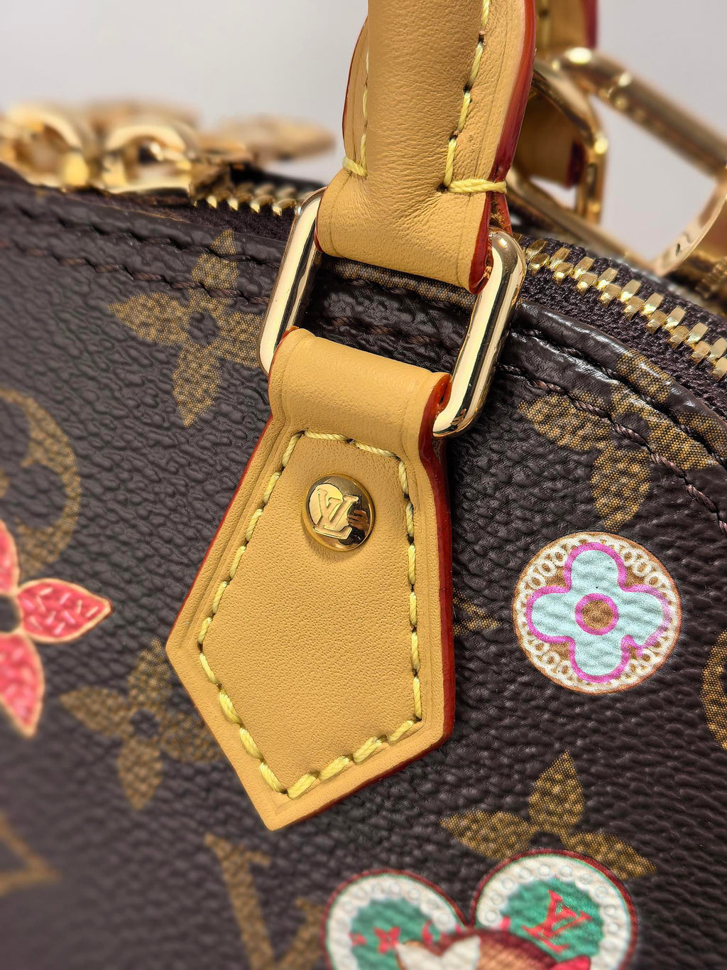 LOUIS VUITTON LV 25S NANO ALMA 18 IN BROWN MONOGRAM CANVAS PRINTED WITH THE VIVIENNE MASCOT