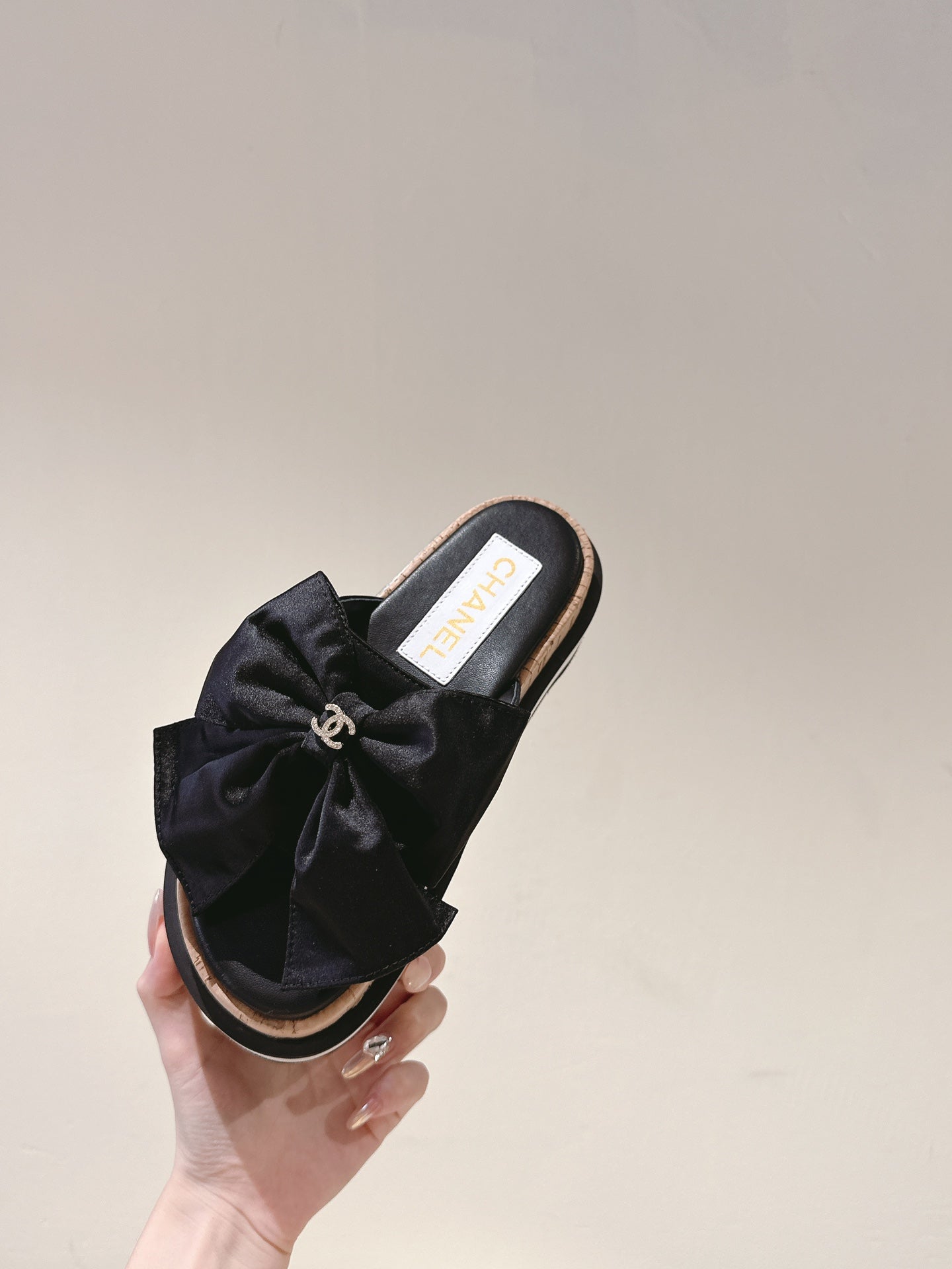 CHANEL SLIPPERS WITH SILK BOW IN BLACK COWHIDE