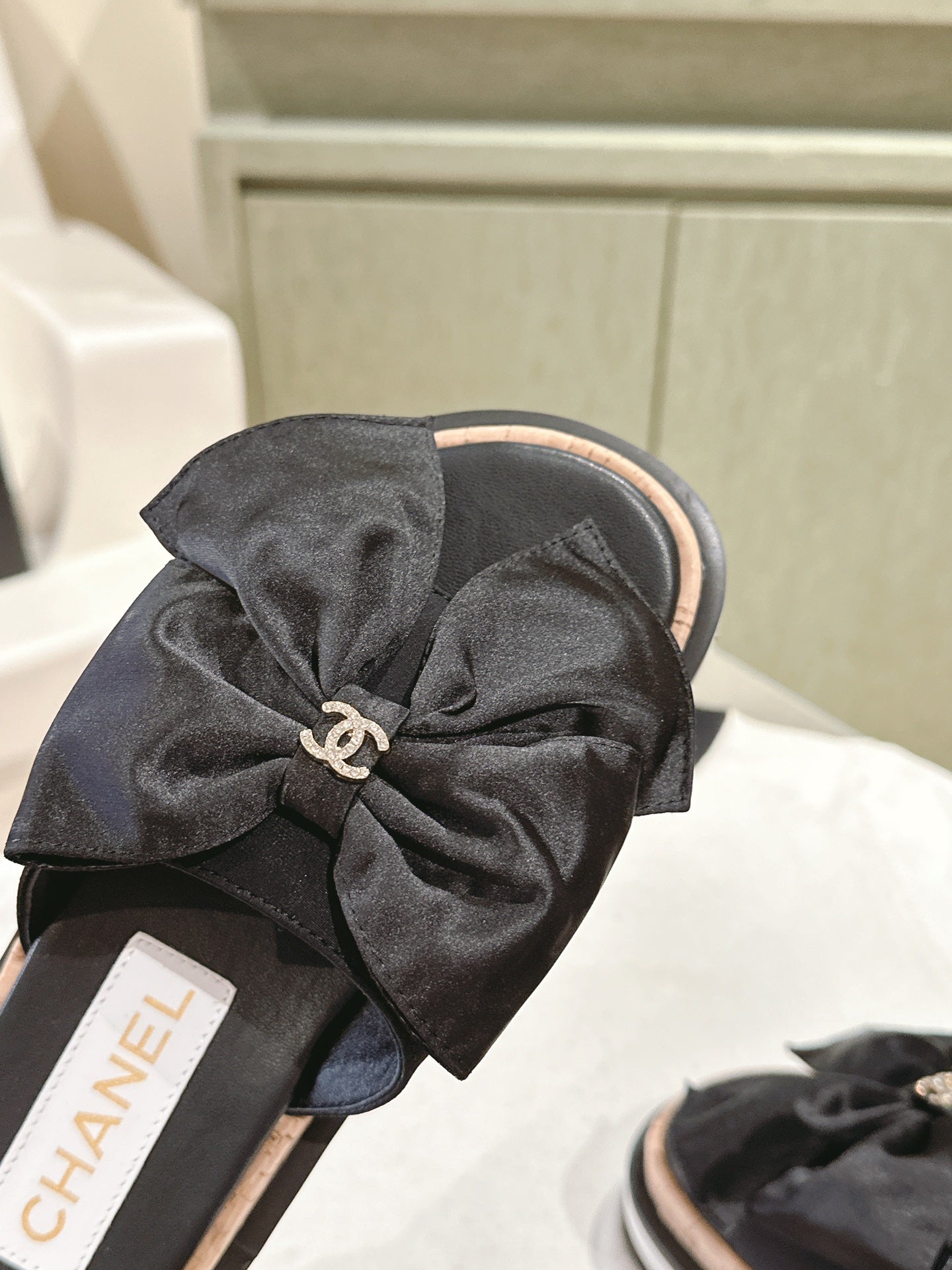 CHANEL SLIPPERS WITH SILK BOW IN BLACK COWHIDE