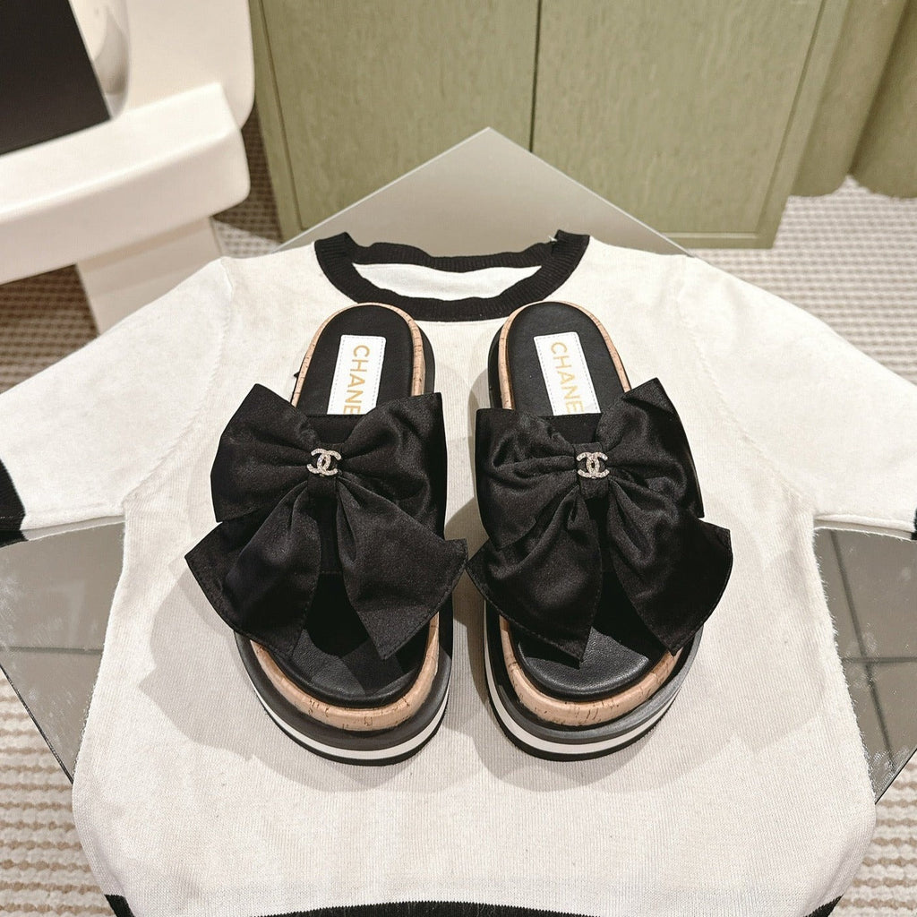 CHANEL SLIPPERS WITH SILK BOW IN BLACK COWHIDE