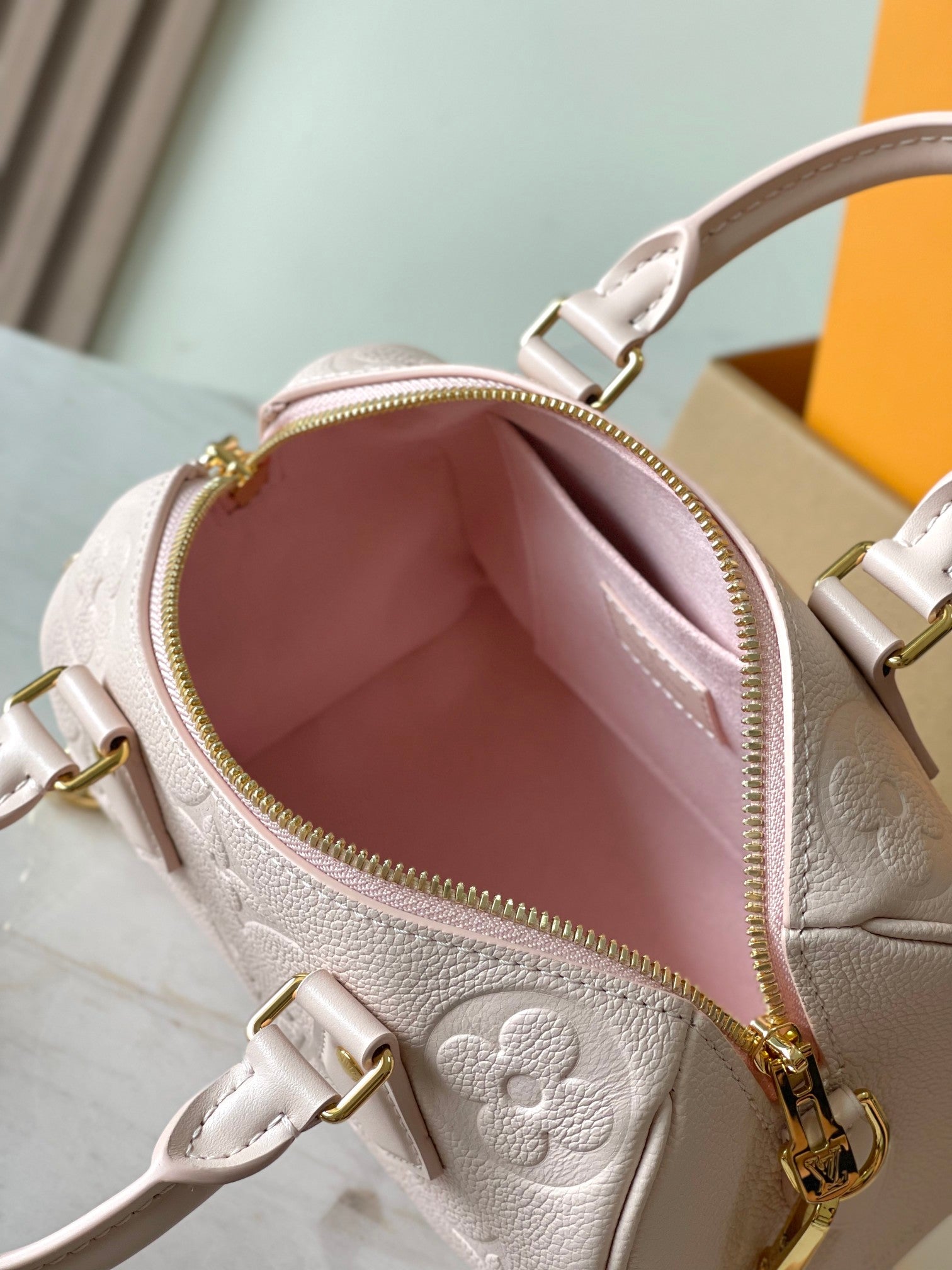 LOUIS VUITTON SPEEDY BANDOULIÈRE 20 IN LIGHT PINK MONOGRAM EMPREINTE LEATHER