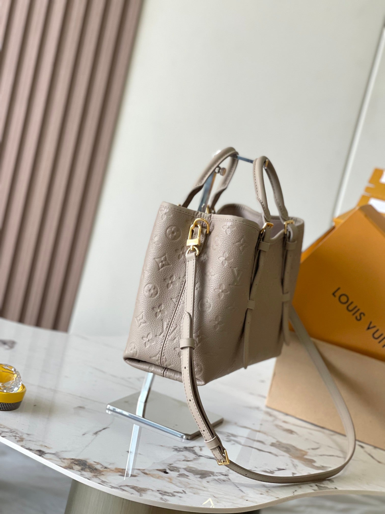 LOUIS VUITTON BABYLONE TOTE 31 IN TOURTERELLE MONOGRAM EMPREINTE LEATHER