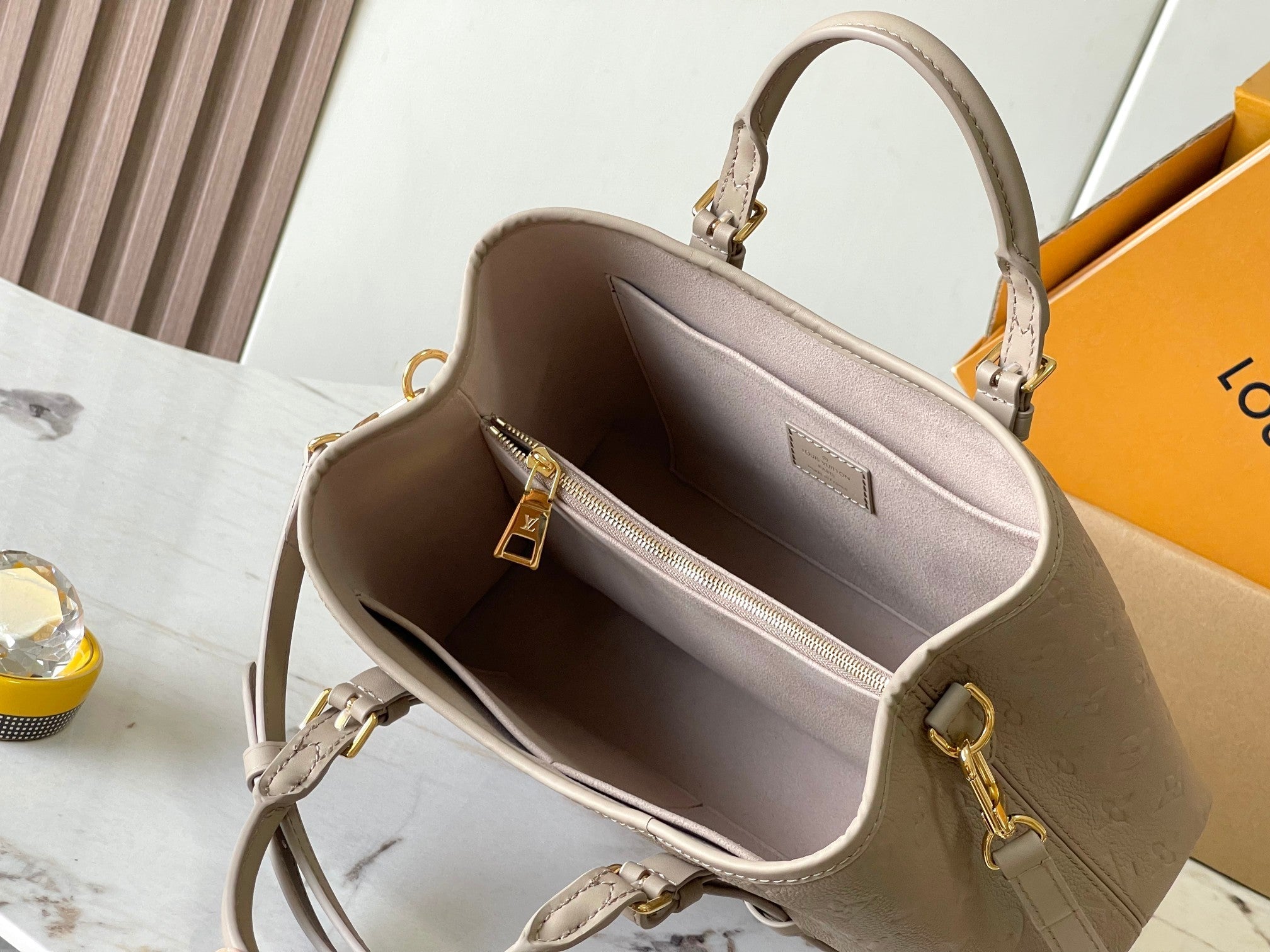 LOUIS VUITTON BABYLONE TOTE 31 IN TOURTERELLE MONOGRAM EMPREINTE LEATHER