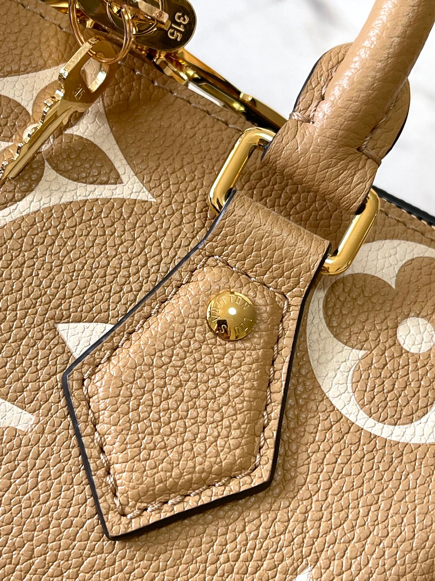 LOUIS VUITTON SPEEDY BANDOULIÈRE 20 IN MILK TEA MONOGRAM EMPREINTE LEATHER
