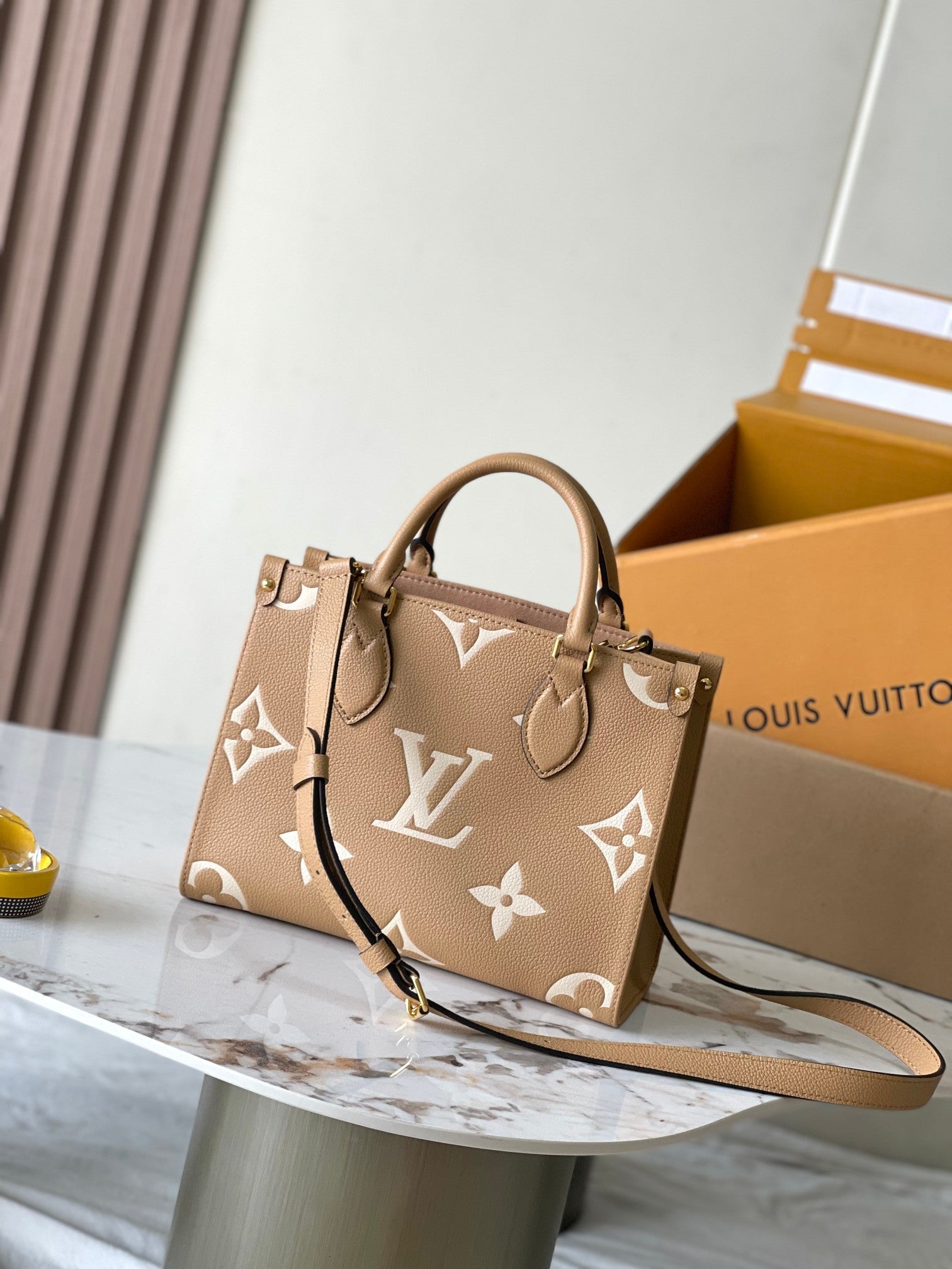 LOUIS VUITTON ONTHEGO PM 25 IN MILK TEA MONOGRAM IMPREINTE LEATHER