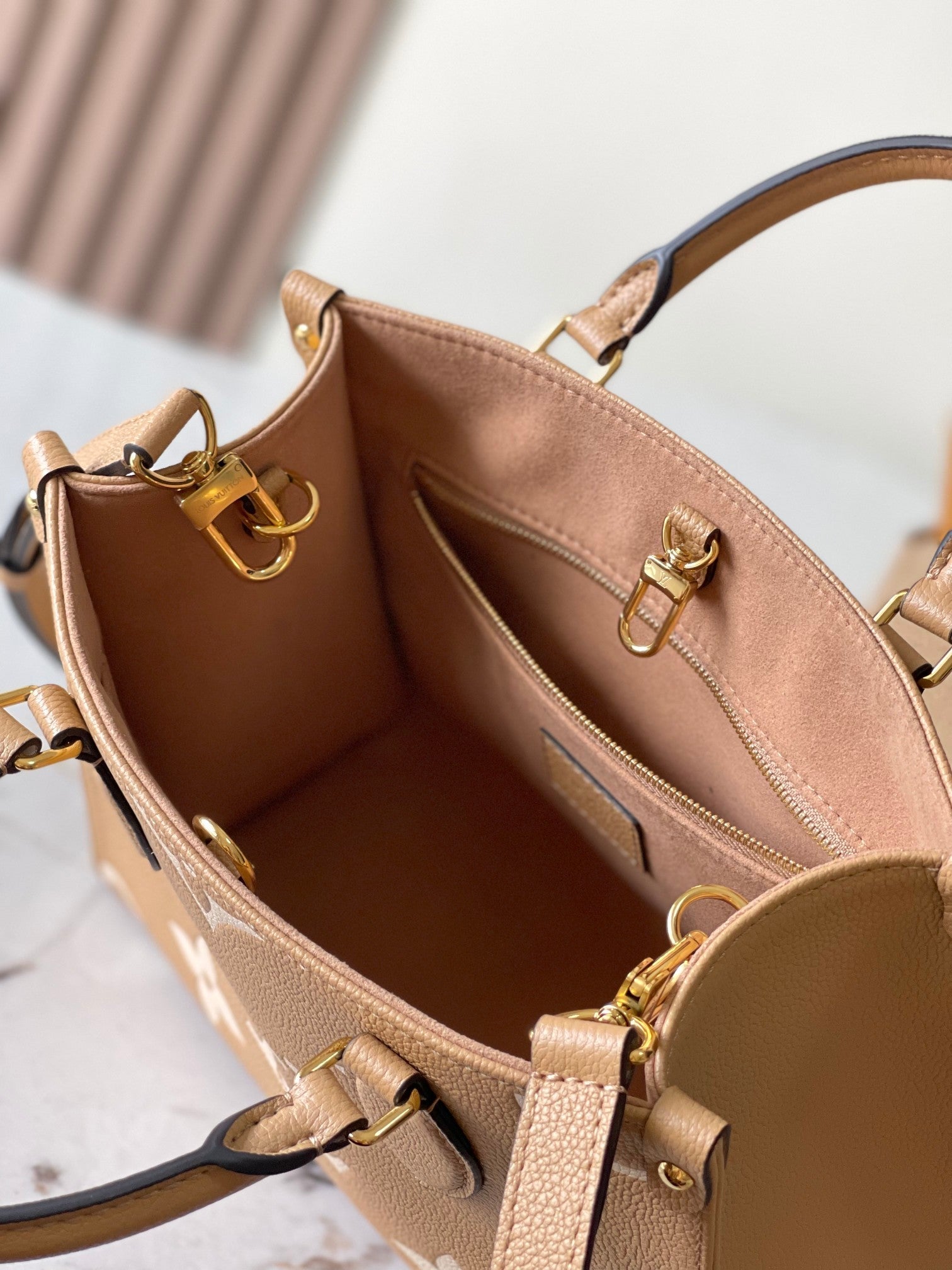 LOUIS VUITTON ONTHEGO PM 25 IN MILK TEA MONOGRAM IMPREINTE LEATHER