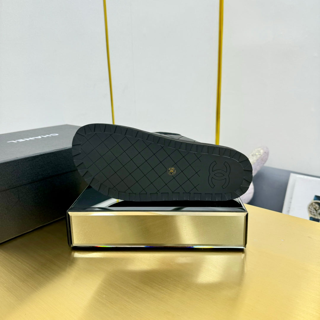 CHANEL THICK-SOLED SLIDE IN BLACK LAMBSKIN AND WOOL LINING