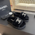 CHANEL SLIPPERS IN BLACK FUR