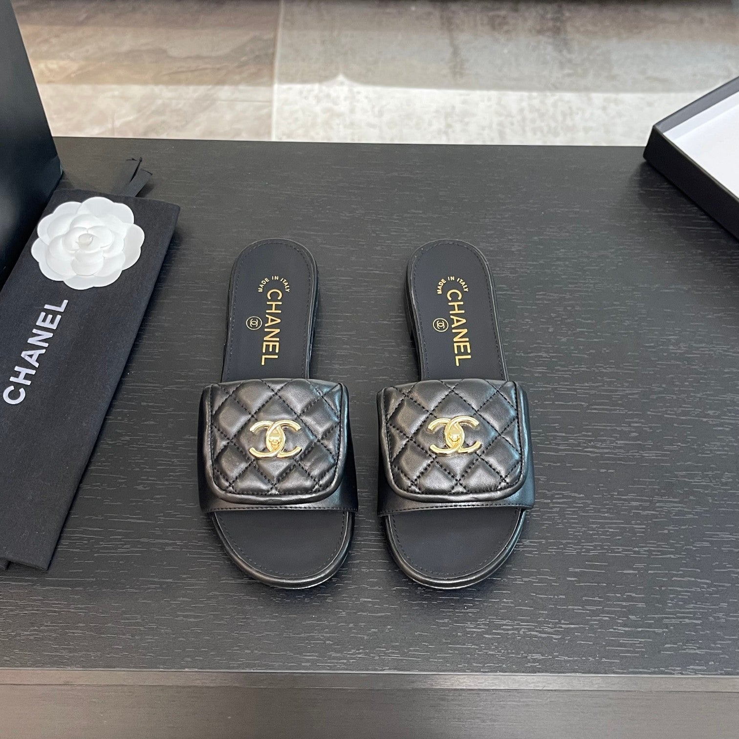 CHANEL FLAT MULE IN BLACK LAMBSKIN