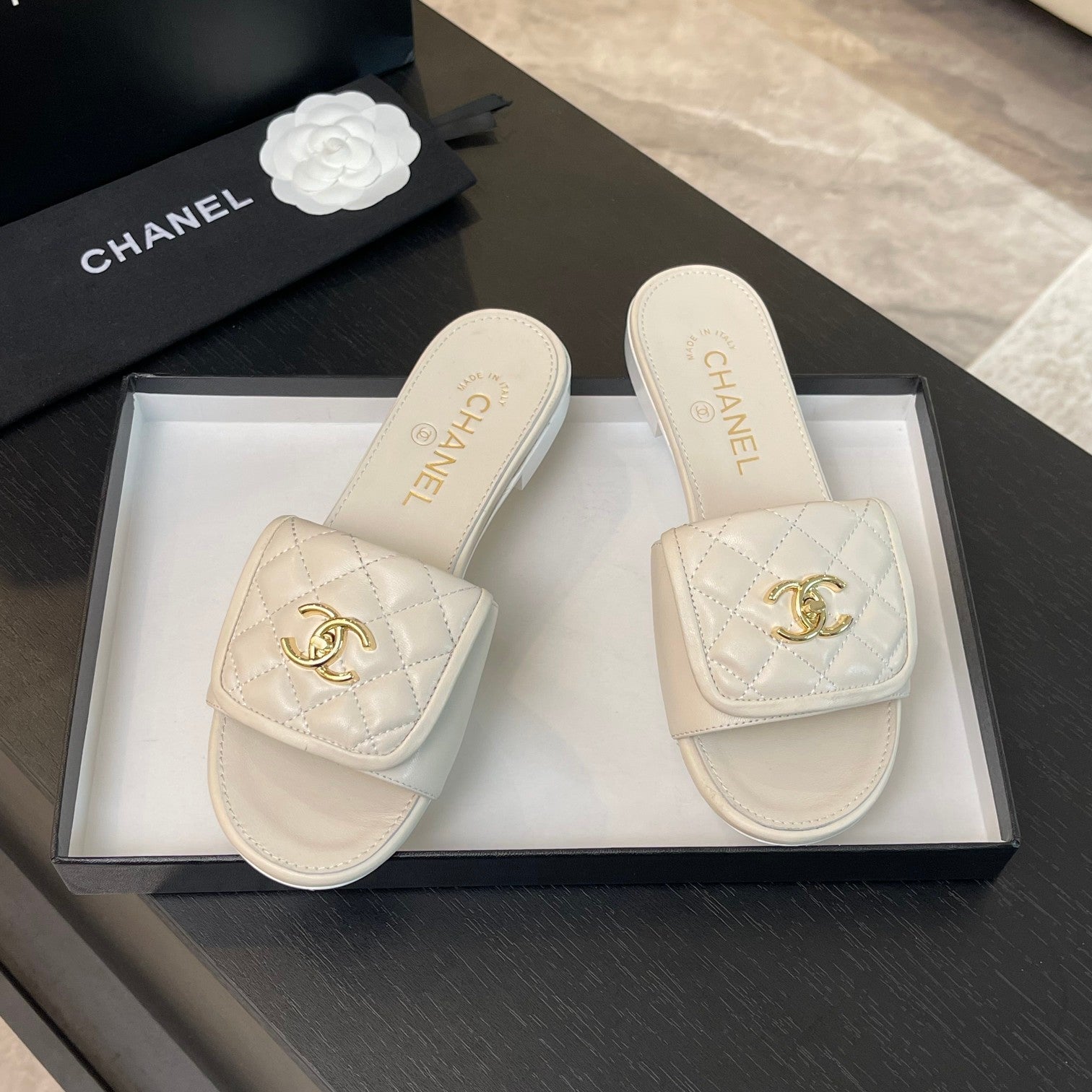 CHANEL FLAT MULE IN WHITE LAMBSKIN