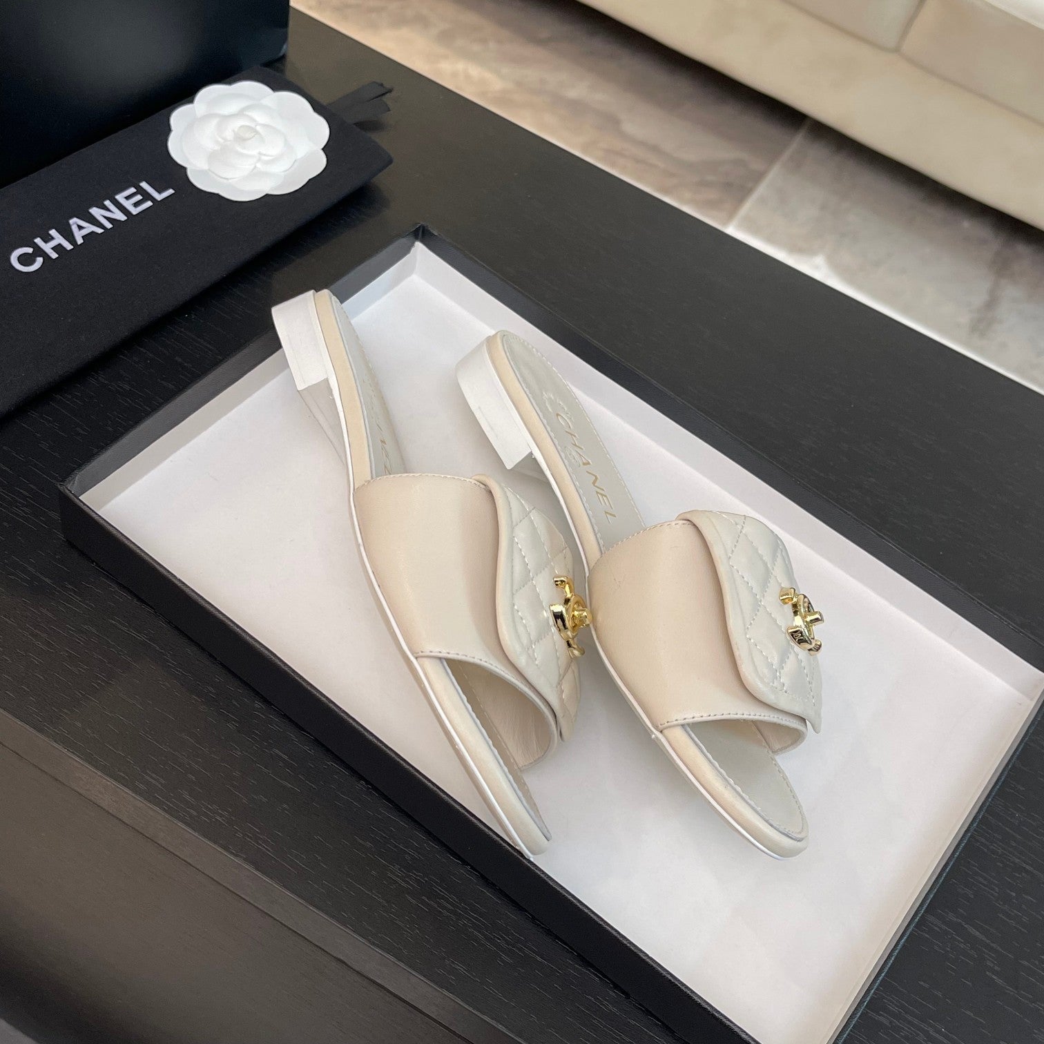 CHANEL FLAT MULE IN WHITE LAMBSKIN