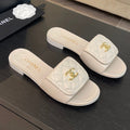 CHANEL FLAT MULE IN WHITE LAMBSKIN