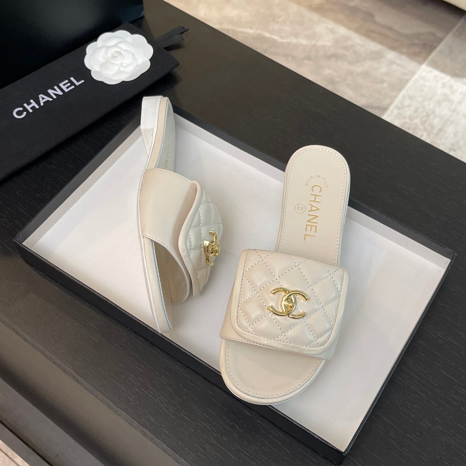 CHANEL FLAT MULE IN WHITE LAMBSKIN