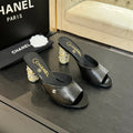 CHANEL T-STRAP PEARL HEEL 85 MM SANDALS IN BLACK LAMBSKIN MULE