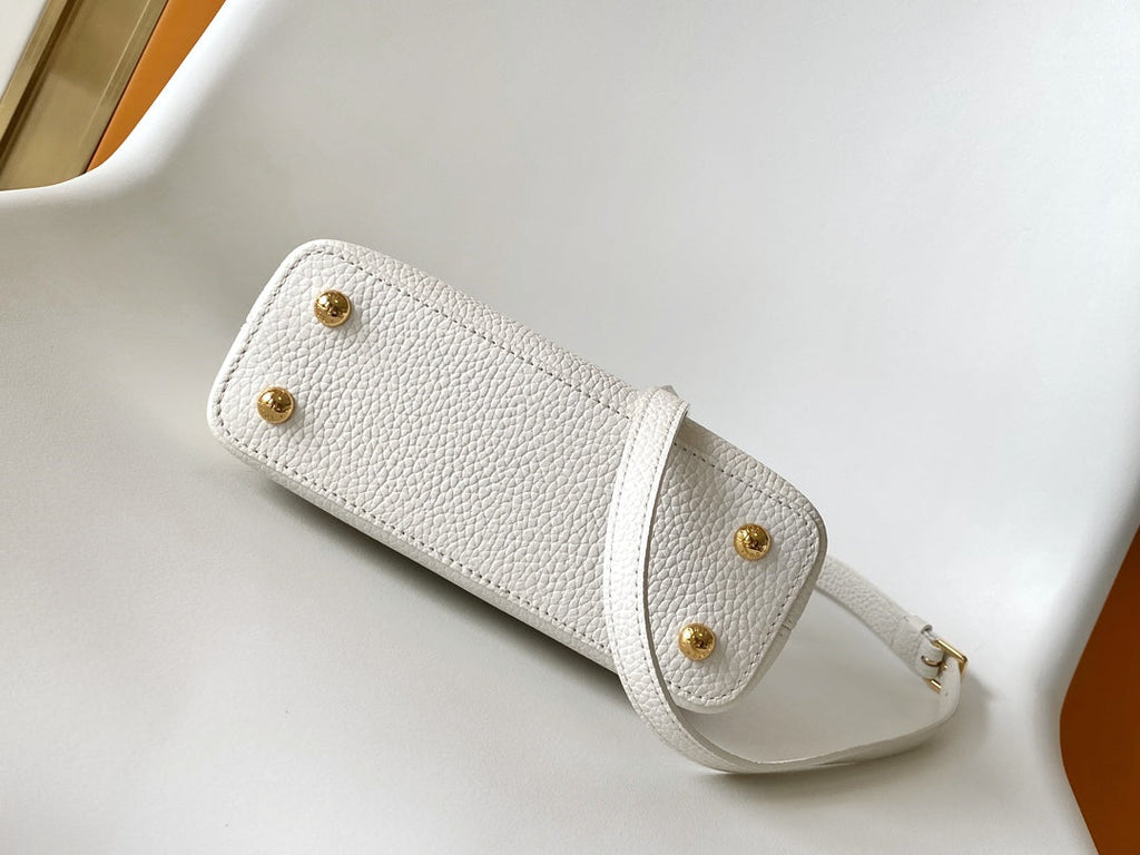 LOUIS VUITTON CAPUCINES EAST-WEST MINI 21 IN WHITE TAURILLON LEATHER GOLD-TONE HARDWARE