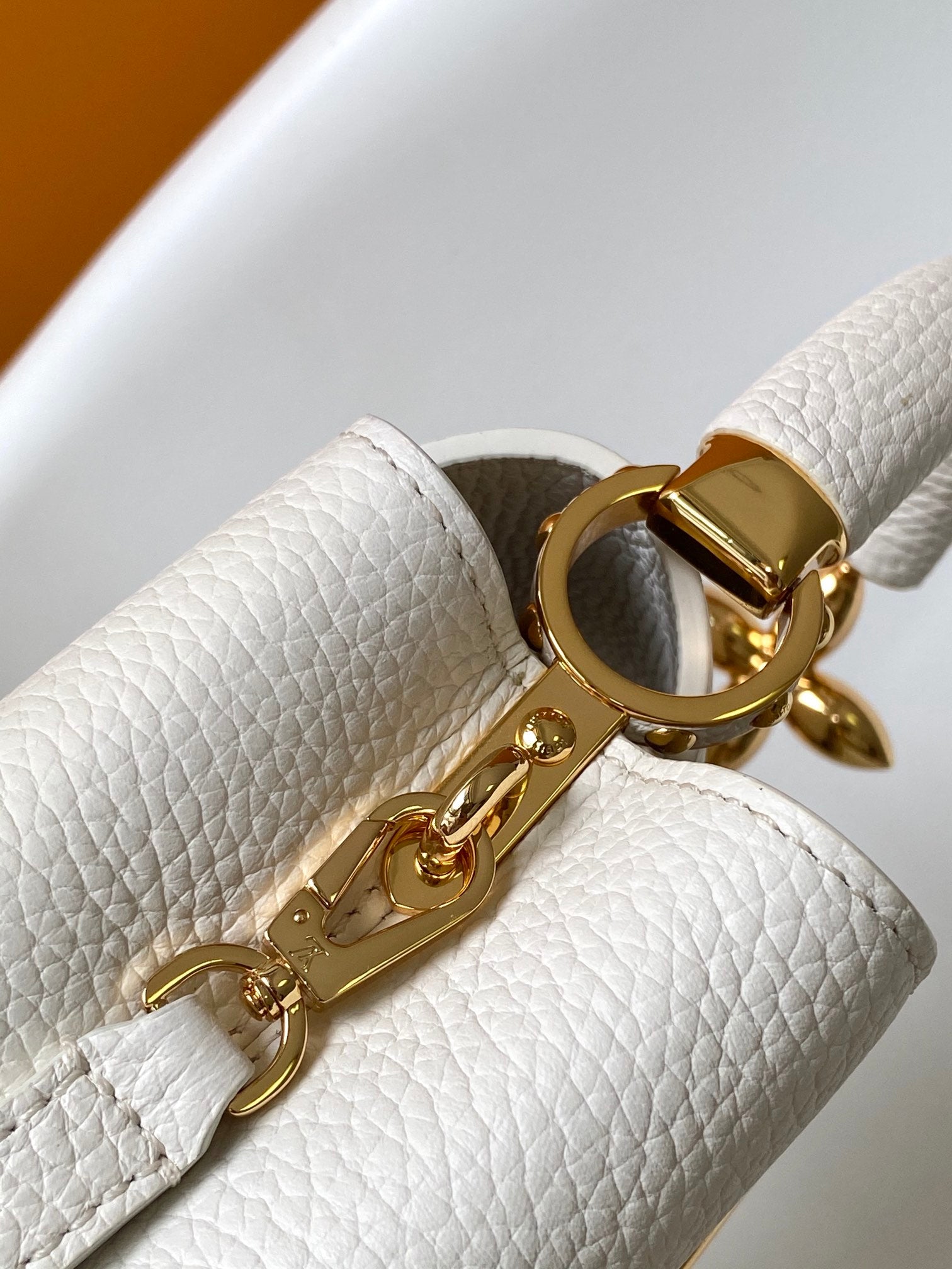 LOUIS VUITTON CAPUCINES EAST-WEST MINI 21 IN WHITE TAURILLON LEATHER GOLD-TONE HARDWARE
