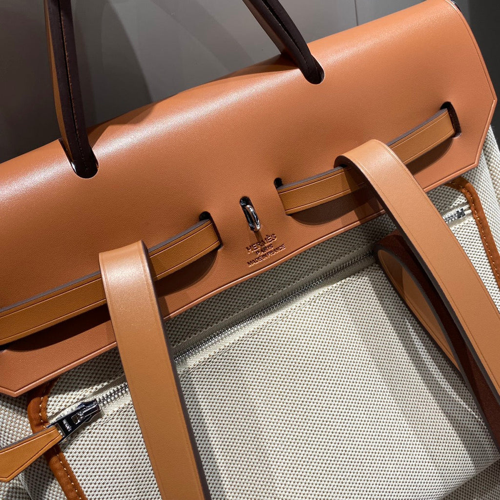 HERMES HERBAG A DOS ZIP RETOURNE BACKPACK 29 IN OFF-WHITE CANVAS AND BROWN CALFSKIN